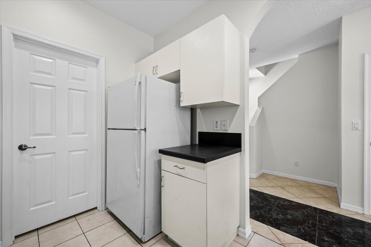 White cabinetry, dark countertops, and a convenient layout. White cabinetry, dark countertops, and a convenient layout.