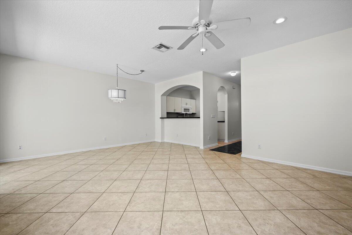 Spacious dining area with an open layout, neutral finishes, and plenty of natural light.
