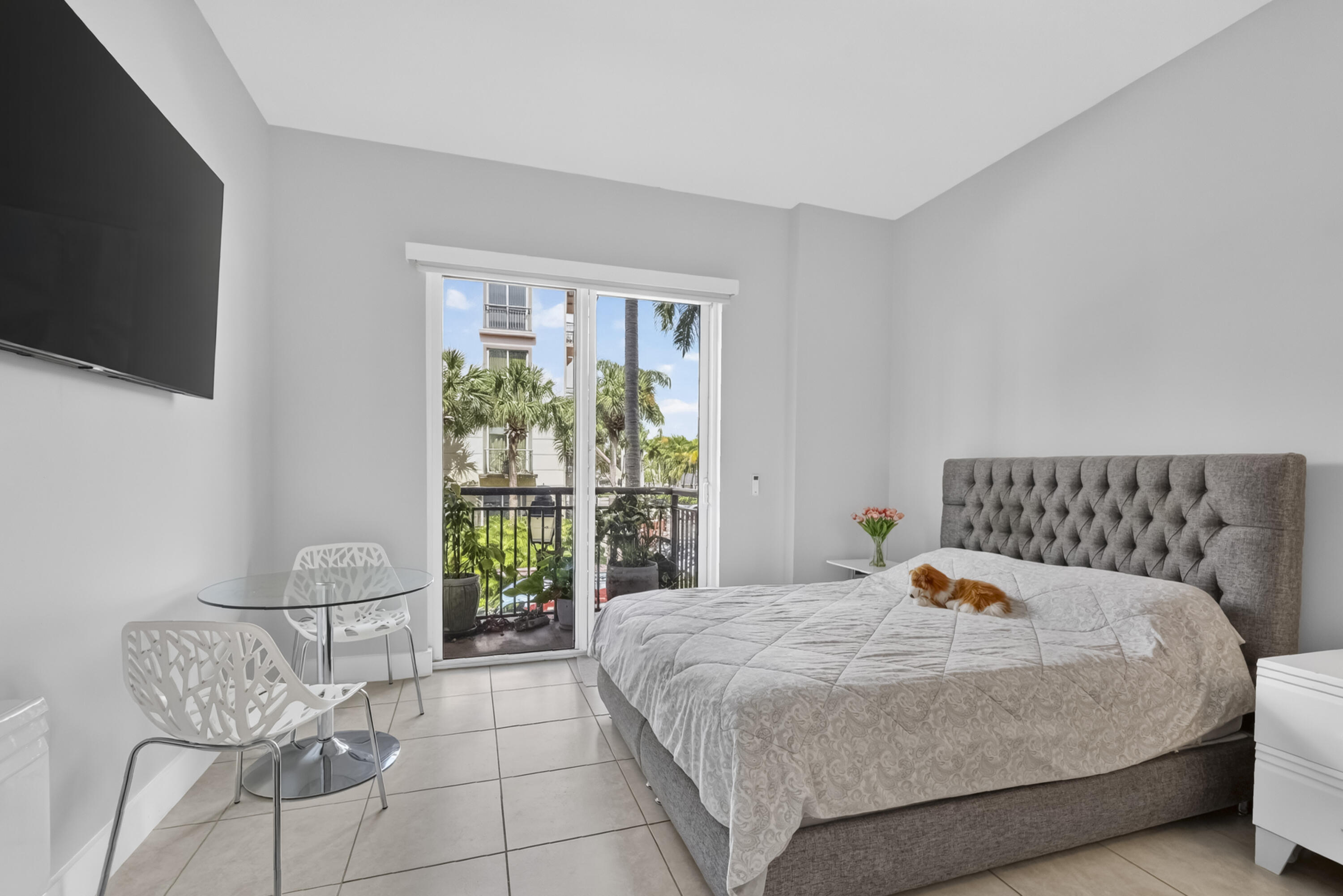 Primary bed room, with balcony & high ceilings. Primary bed room, with balcony & high ceilings.