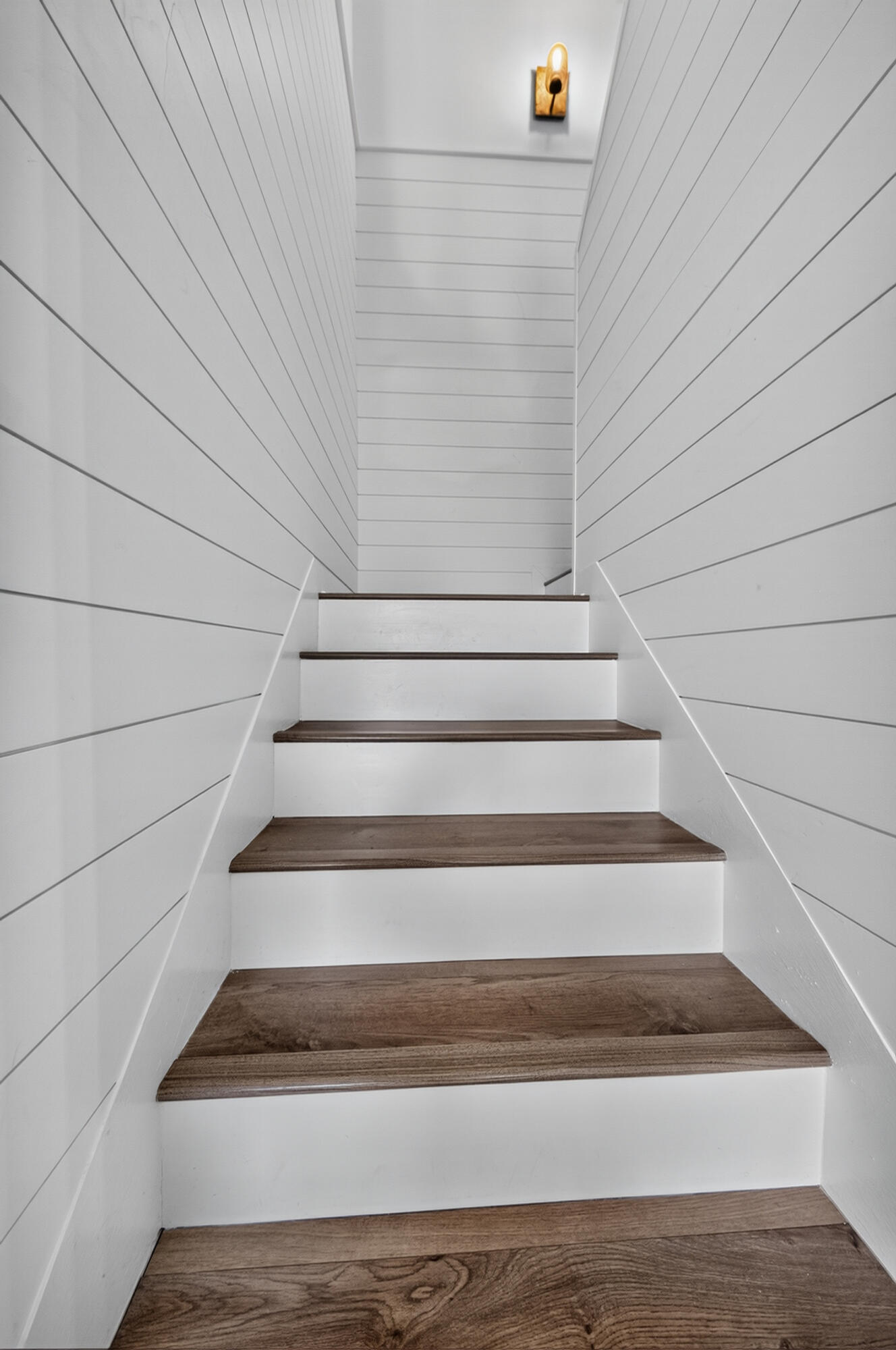 laminated flooring from stairs and second story throughout