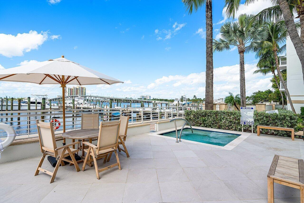 HAVN feels like a private resort with a waterfront pool and hot tub, fitness center, fire pit, outdoor grills, paddleboards, kayaks, bicycles, concierge services, beach service and chauffeured golf-cart transportation around Palm Beach Shores.