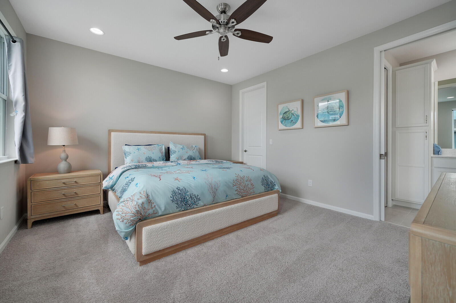 Second Large Primary Bedroom Upstairs with Large Walk-in Closet and Ensuite Bathroom. Neutral-toned room featuring plush wall-to-wall carpeting, recessed ceiling lighting, and a multi-blade ceiling fan