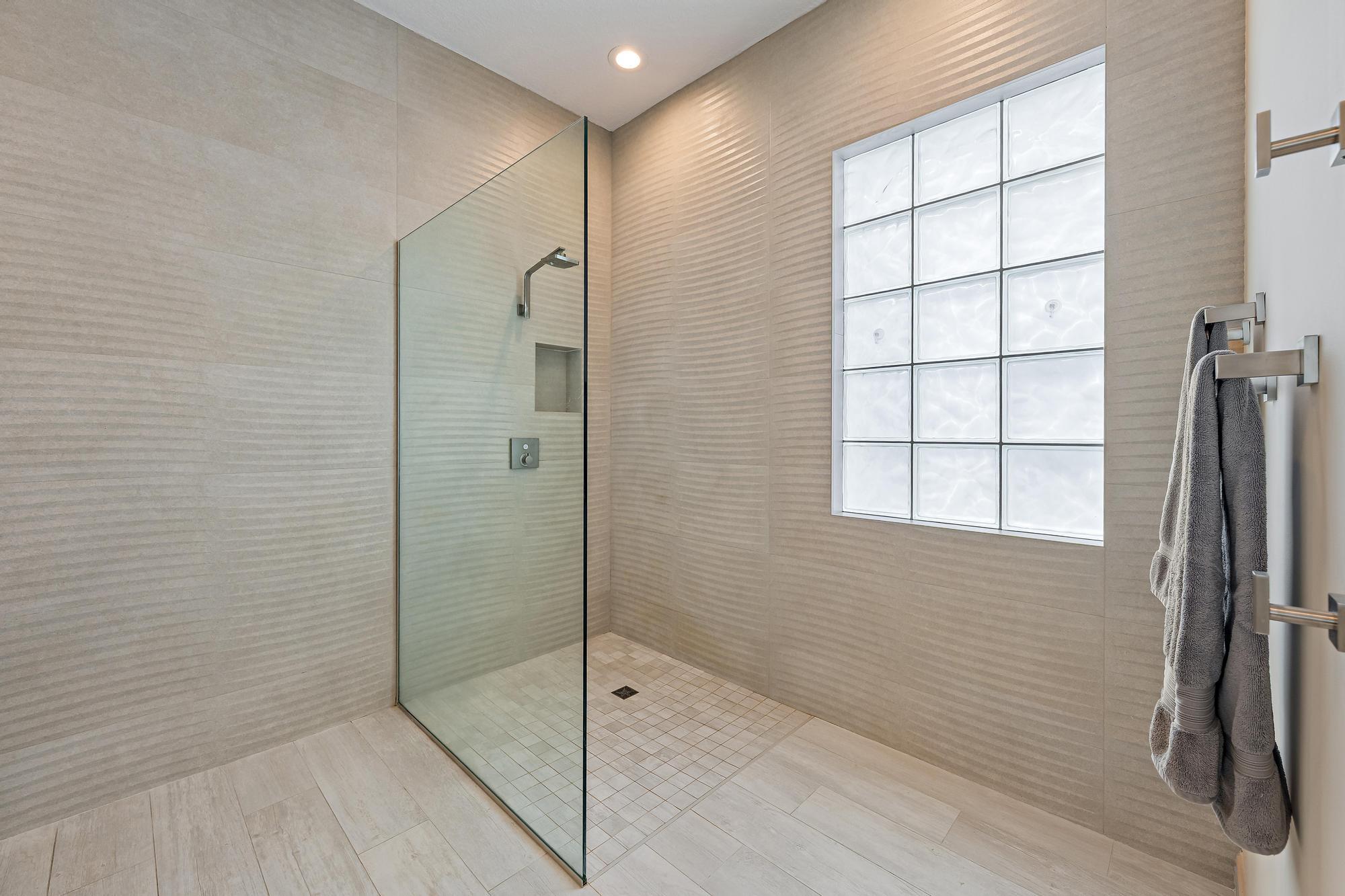 Shower redesigned and enlarged. Level floor entry no lip. Very convenient