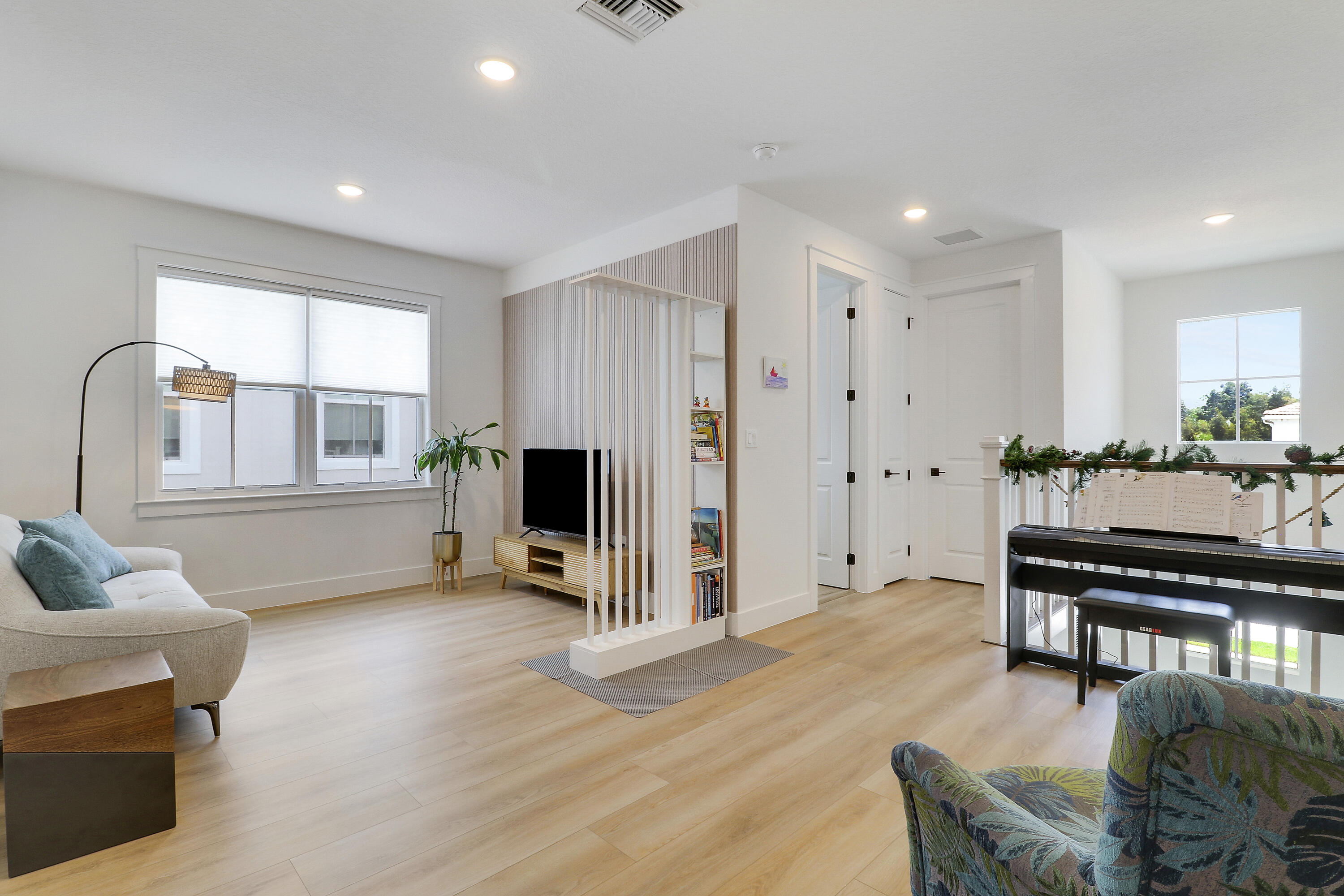 A spacious second-floor living area designed for relaxation and enjoying cozy, intimate moments with family.