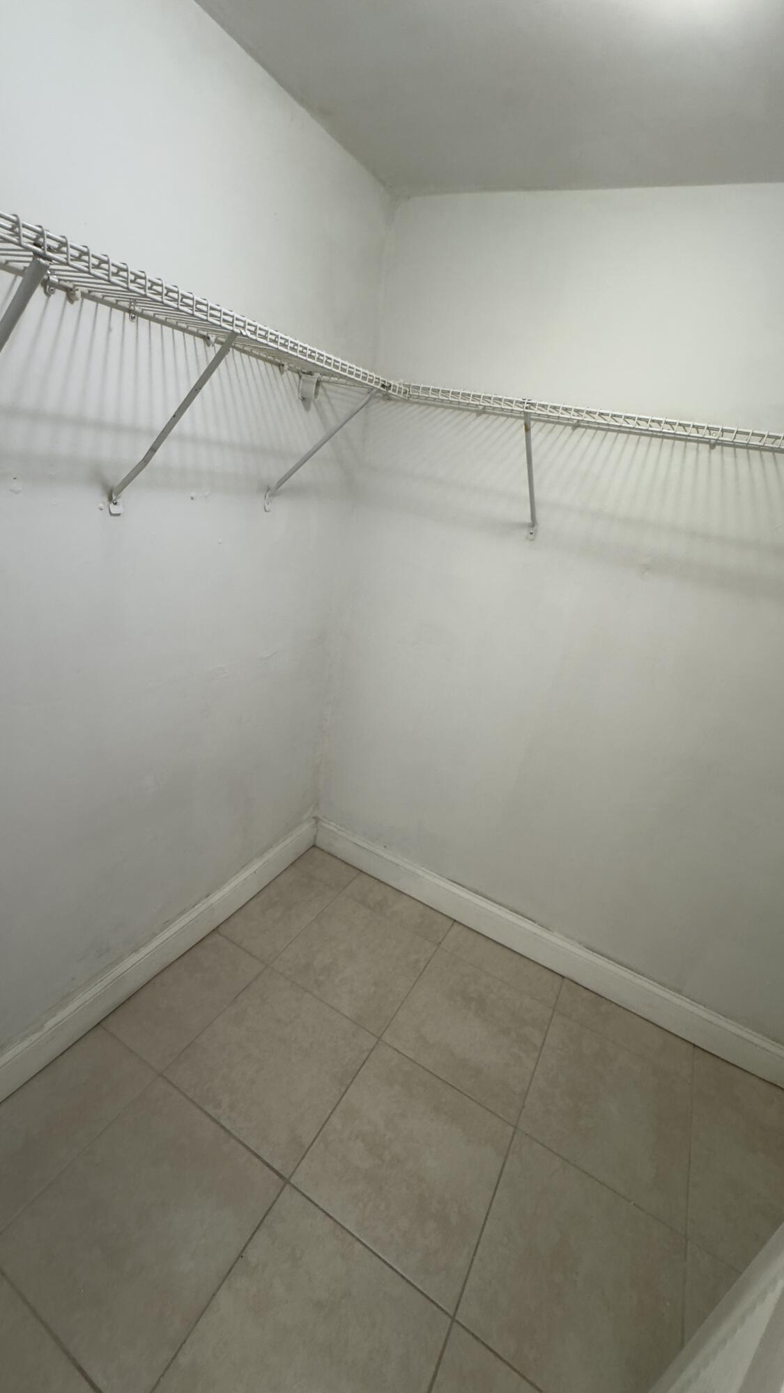 Walk-in closet in primary bedroom