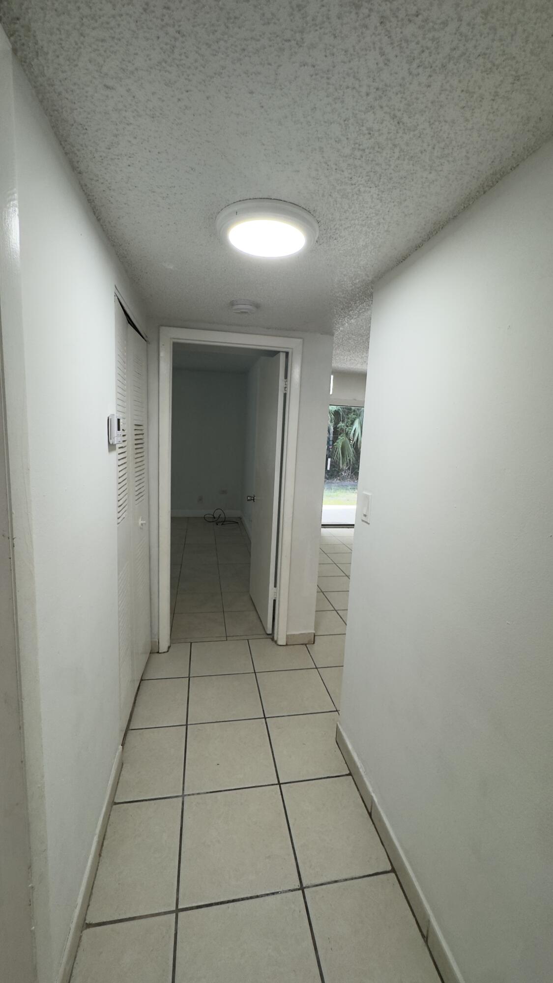 Hallway to primary bedroom