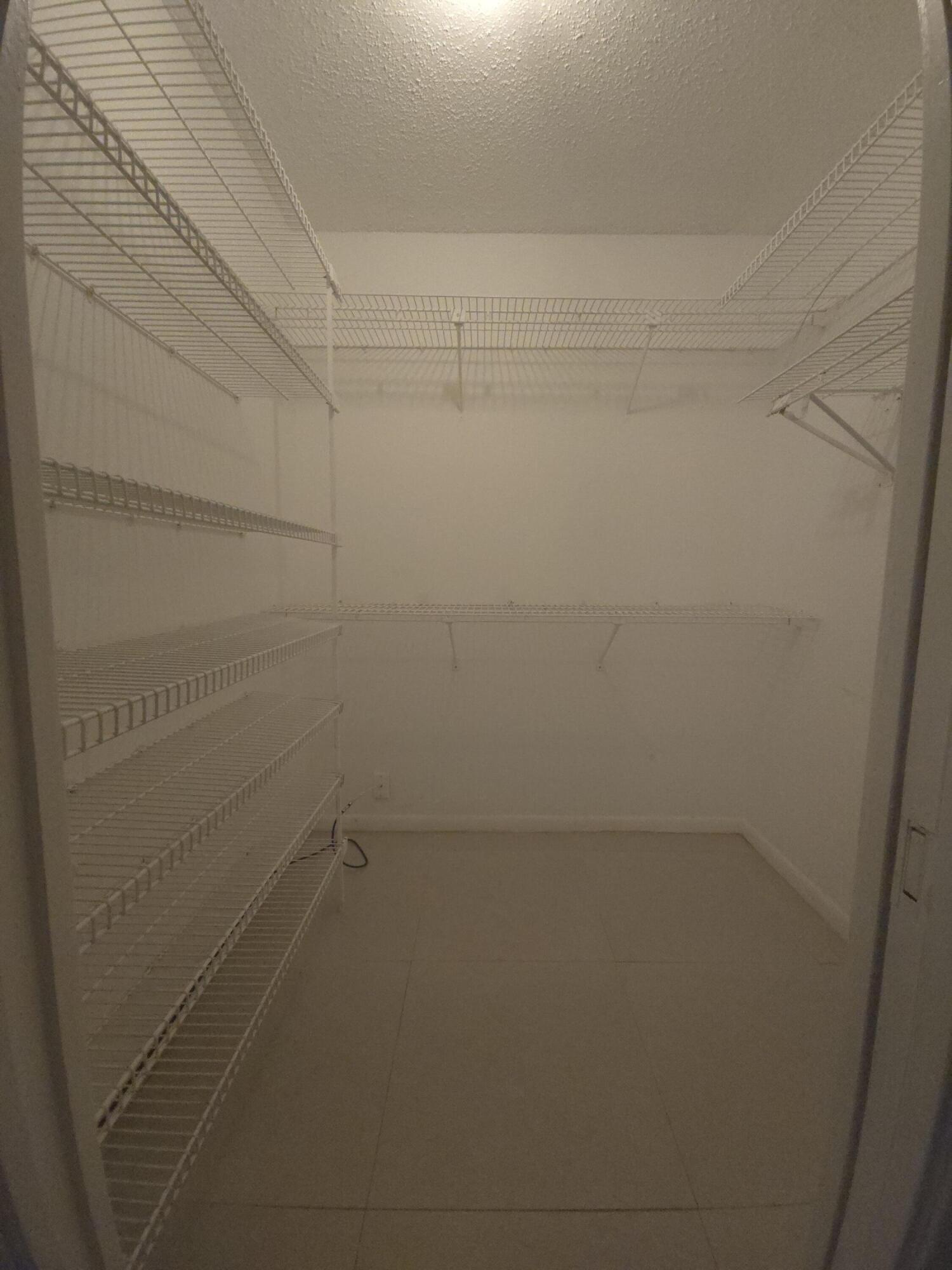 Walk-in closet in primary bedroom