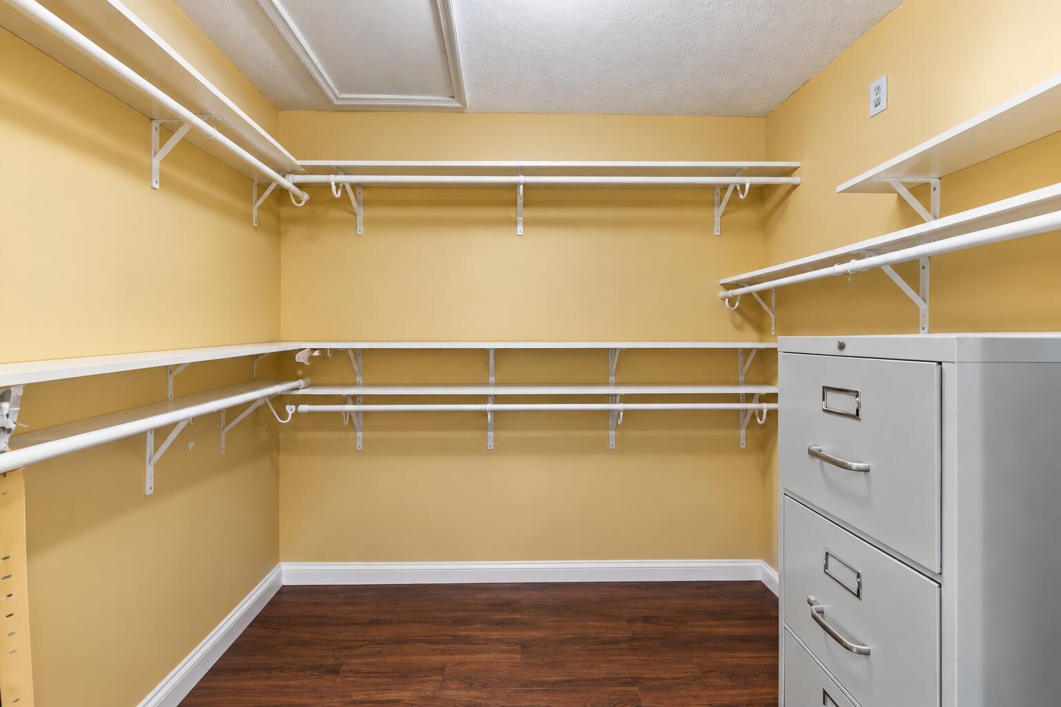 Organized Walk-In Closet with Filing Cab