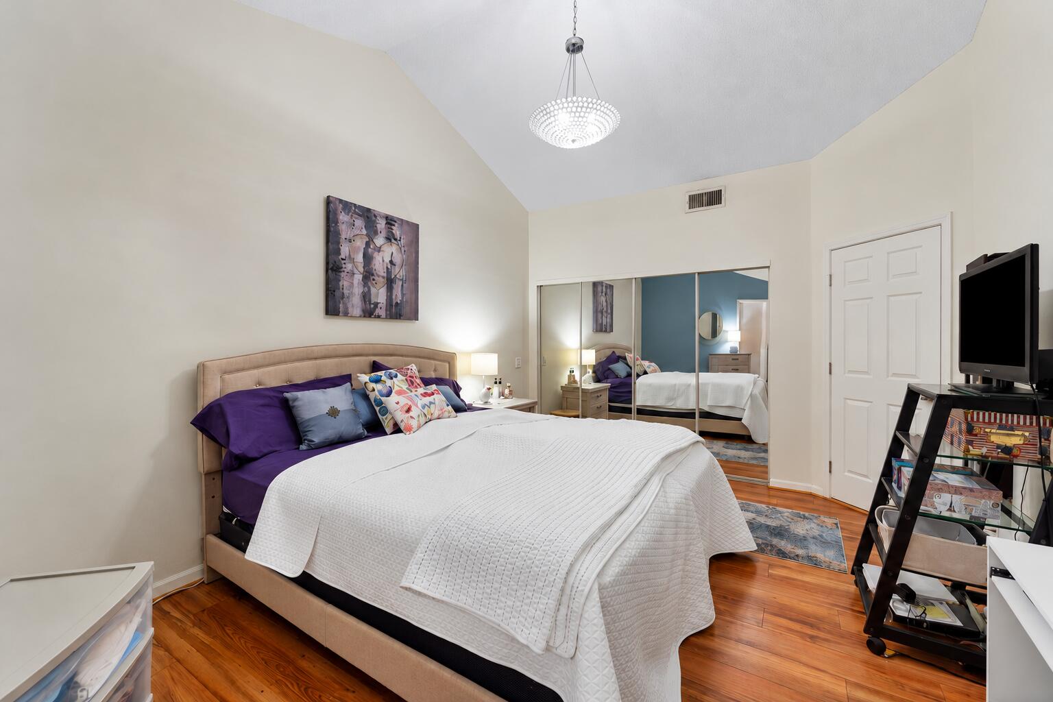 Bright Staged Bedroom with Mirrored Clos