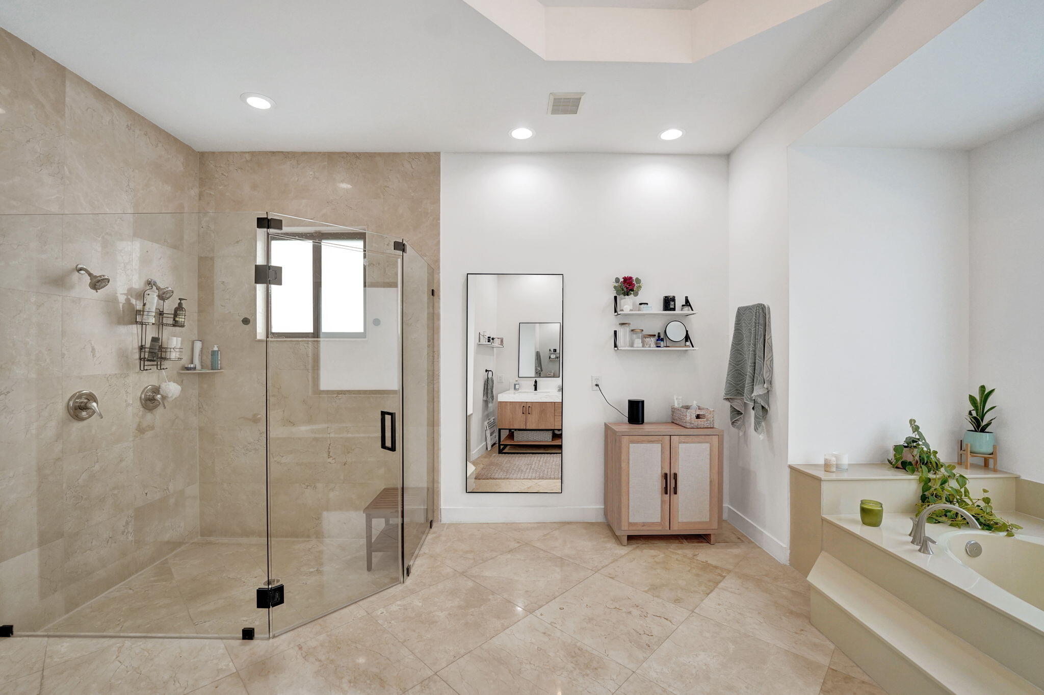 Updated separate shower with full glass enclosure and dual shower heads