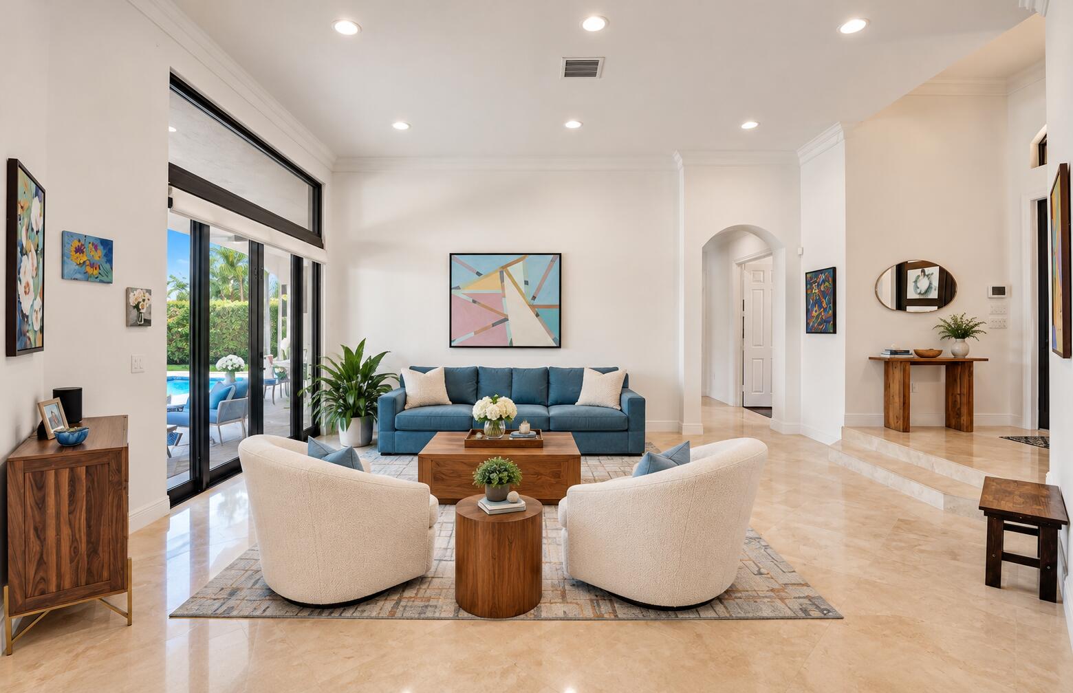 Living room with soaring ceilings and recessed lighting