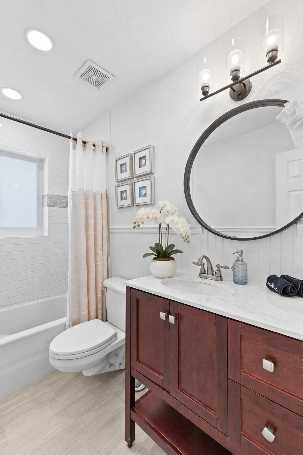Bright Coastal Bathroom with White Orchi