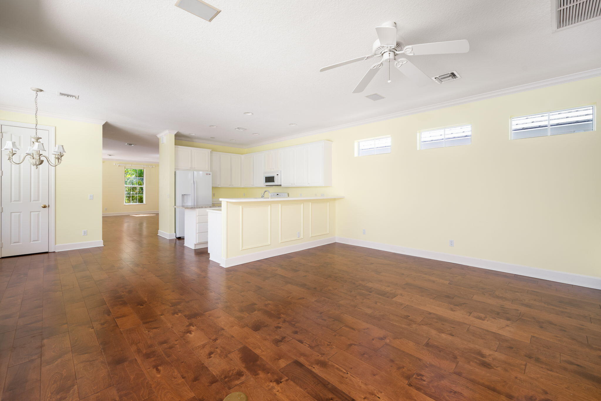 Open living in this family to kitchen light and bright spacious family room. Comes complete with custom shelves, wood floors and sliders that open entirely to wall for indoor outdoor entertaining.