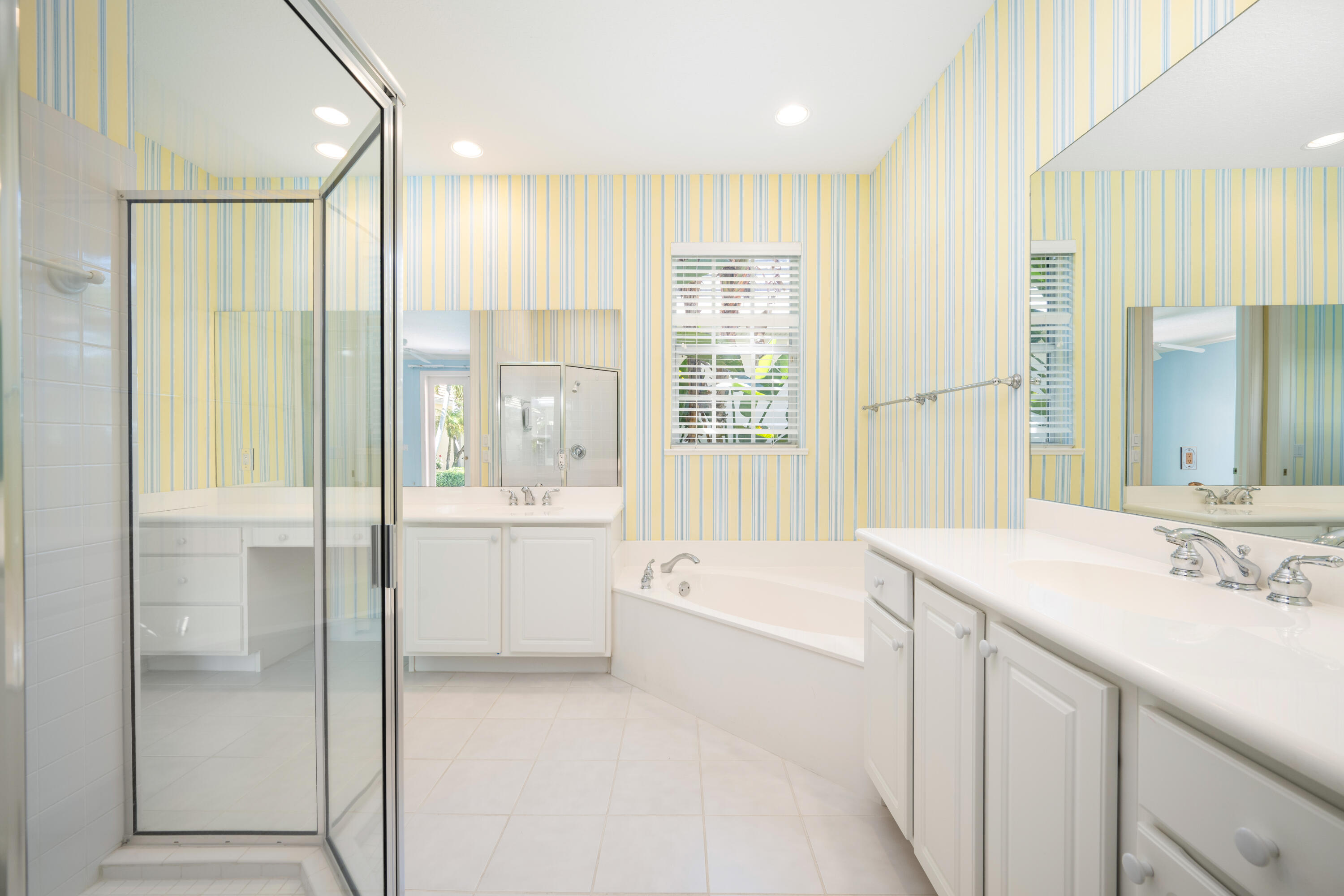 Double sinks, private water closet, step in glass shower, soaking tub and huge walk in closet. Additional walk in off bedroom