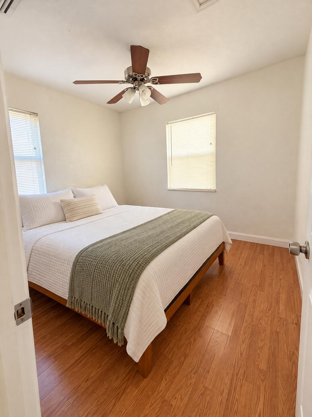 Bright Minimalist Bedroom with Sage Thro