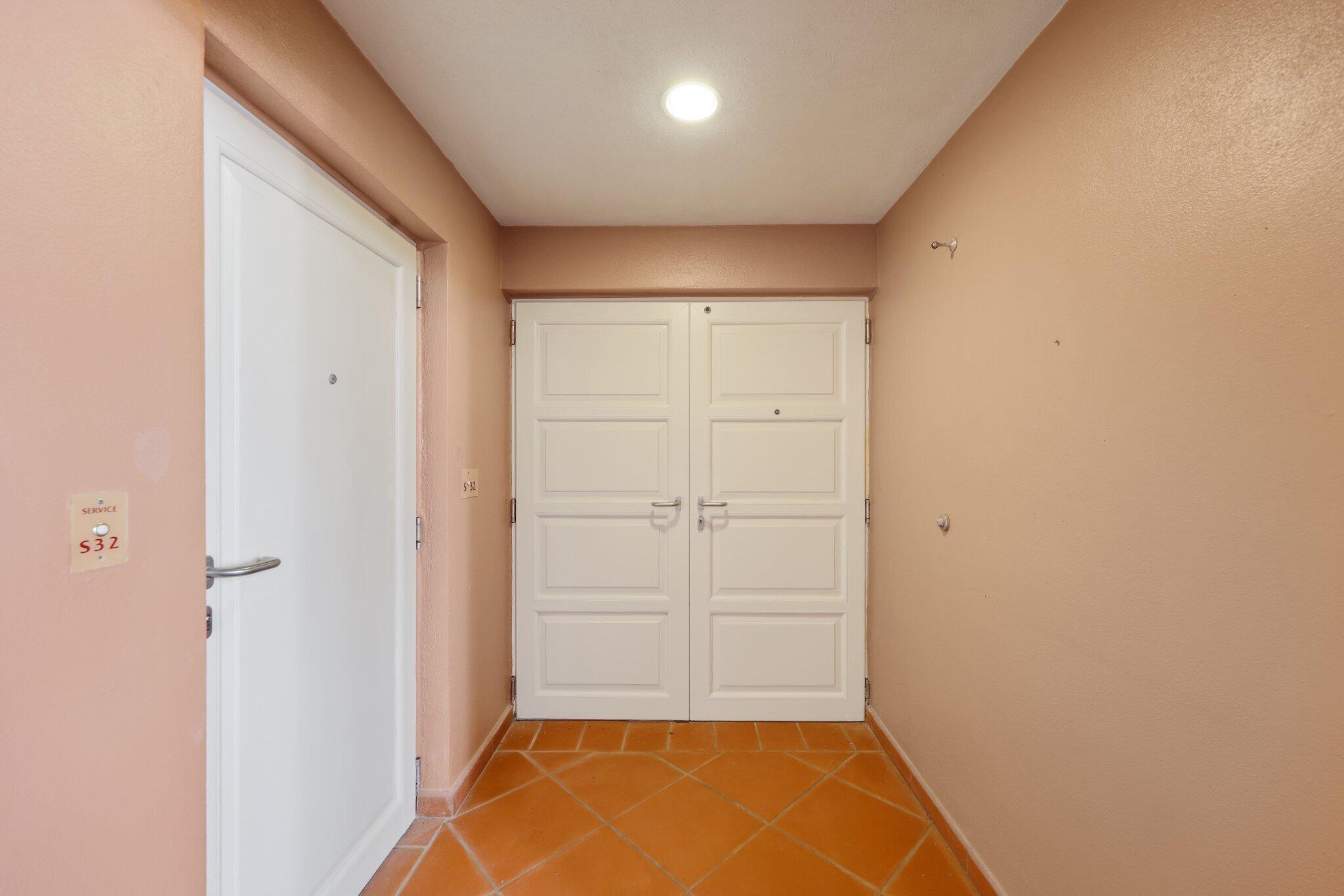 Front Entry to Condominium/Service Door on Side