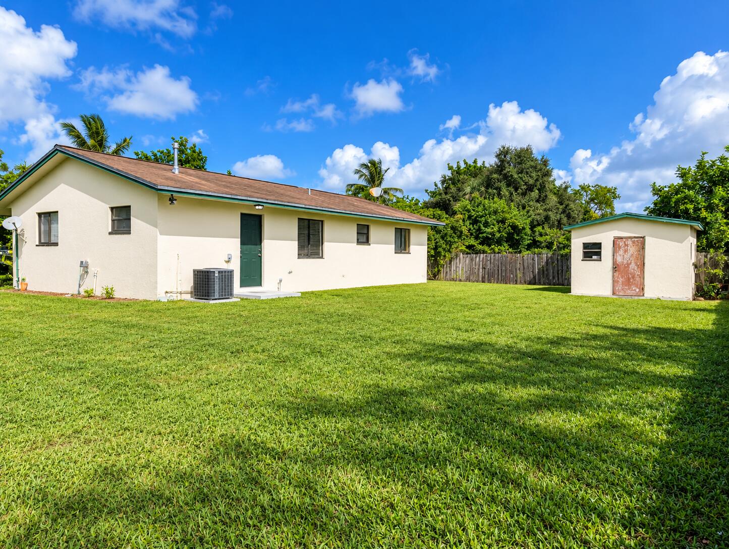 Sunny Tropical Backyard Bungalow and She