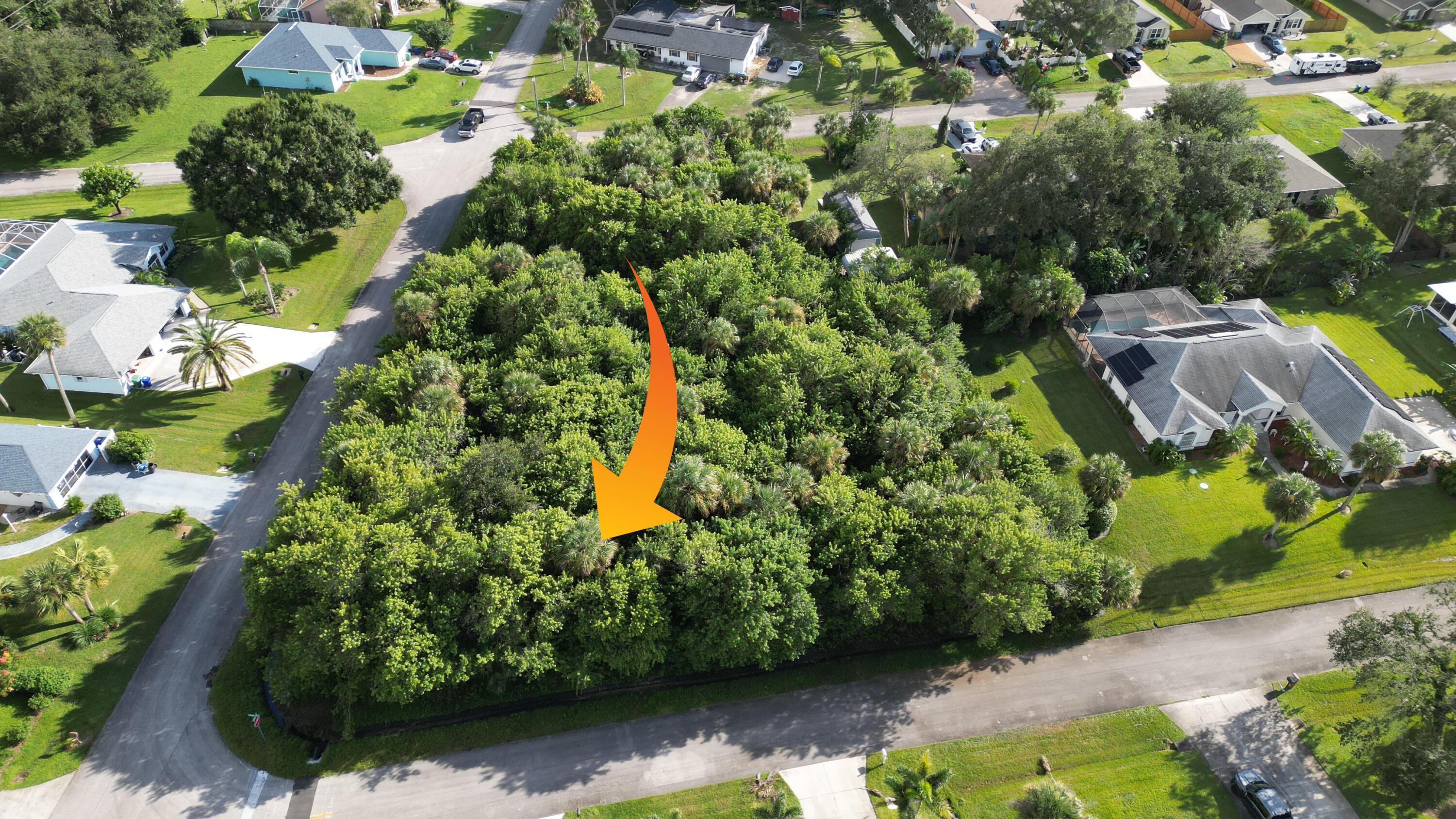 Wooded residential parcel situated at a corner lot with established mature trees and vegetation