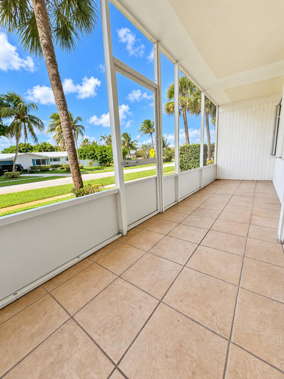 Screened Lanai with Palm Views