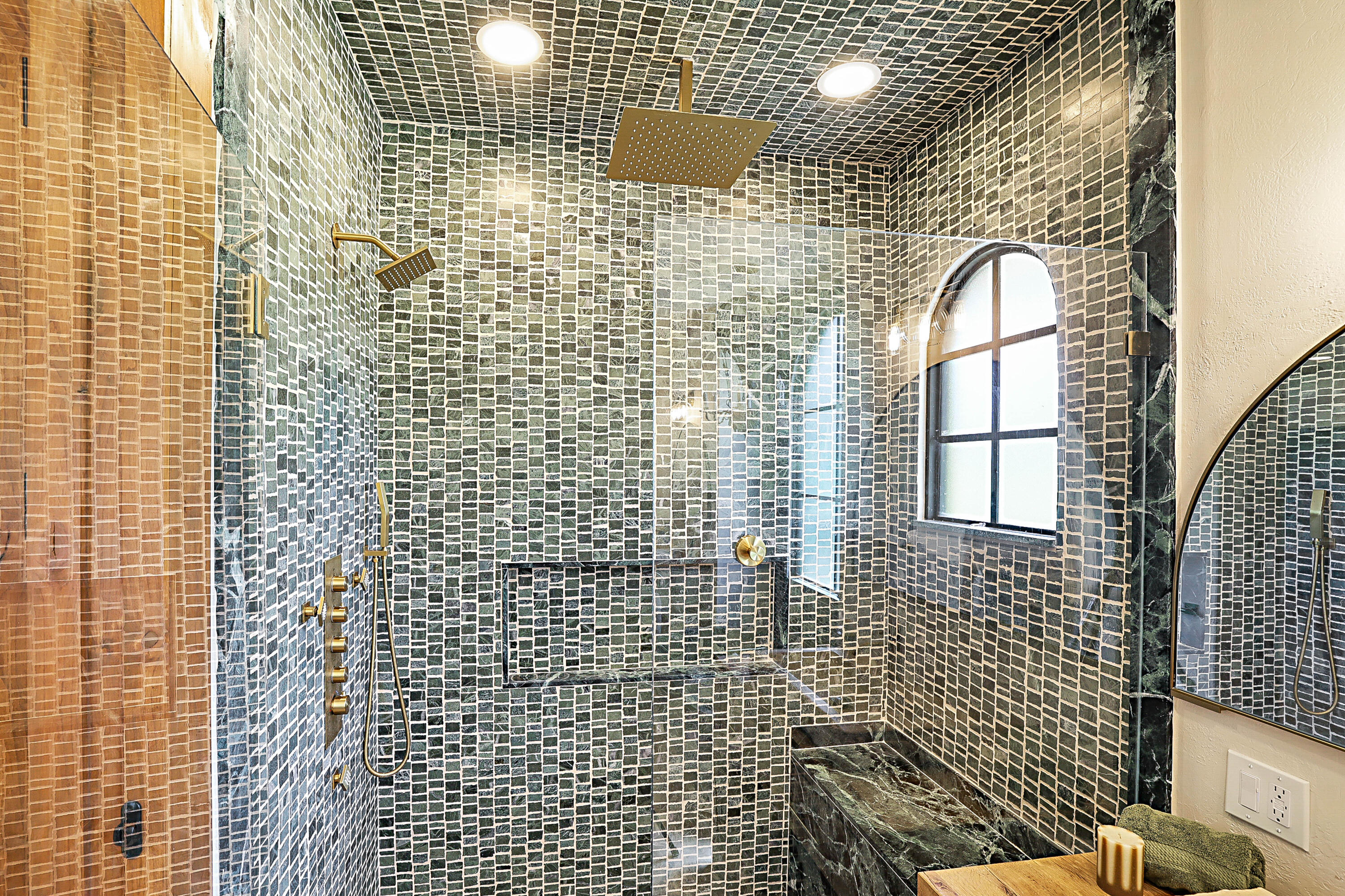 Marble shower with glass enclosure