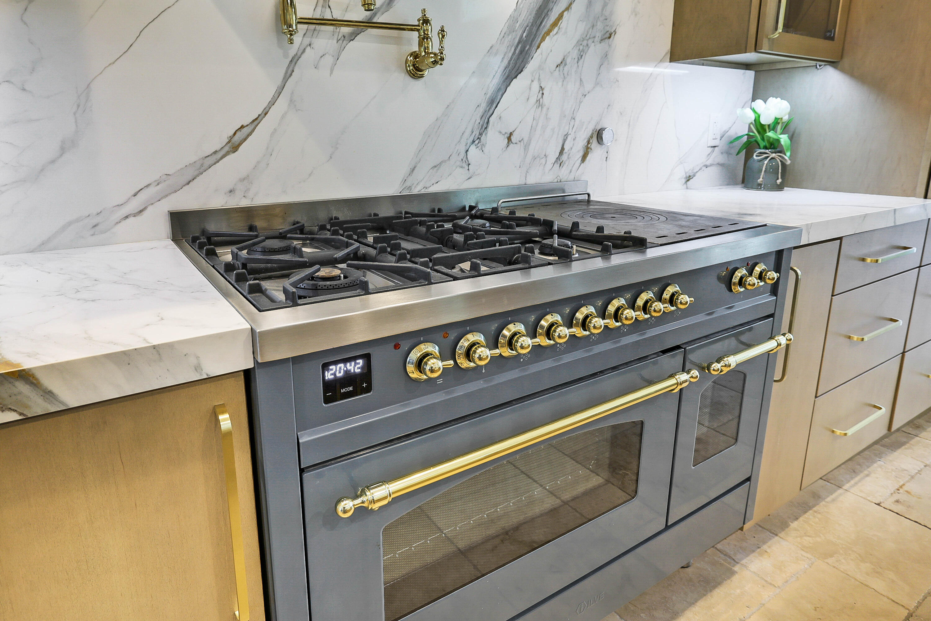 48 Ilve (Italian) propane stove & electric dual ovens with french griddle, reverse osmosis water system for pot filler and sink