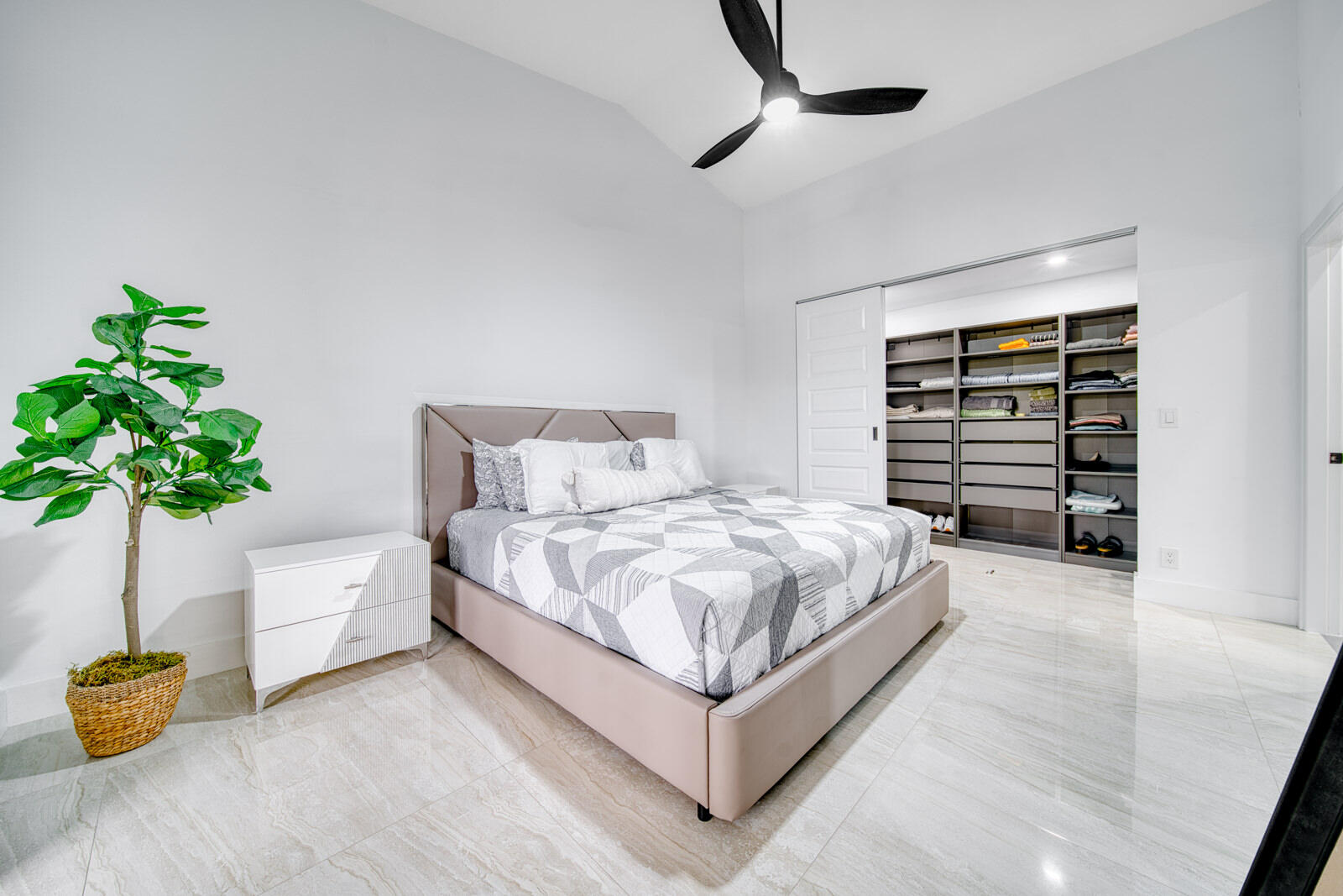 Custom built-in closet provides organized storage.