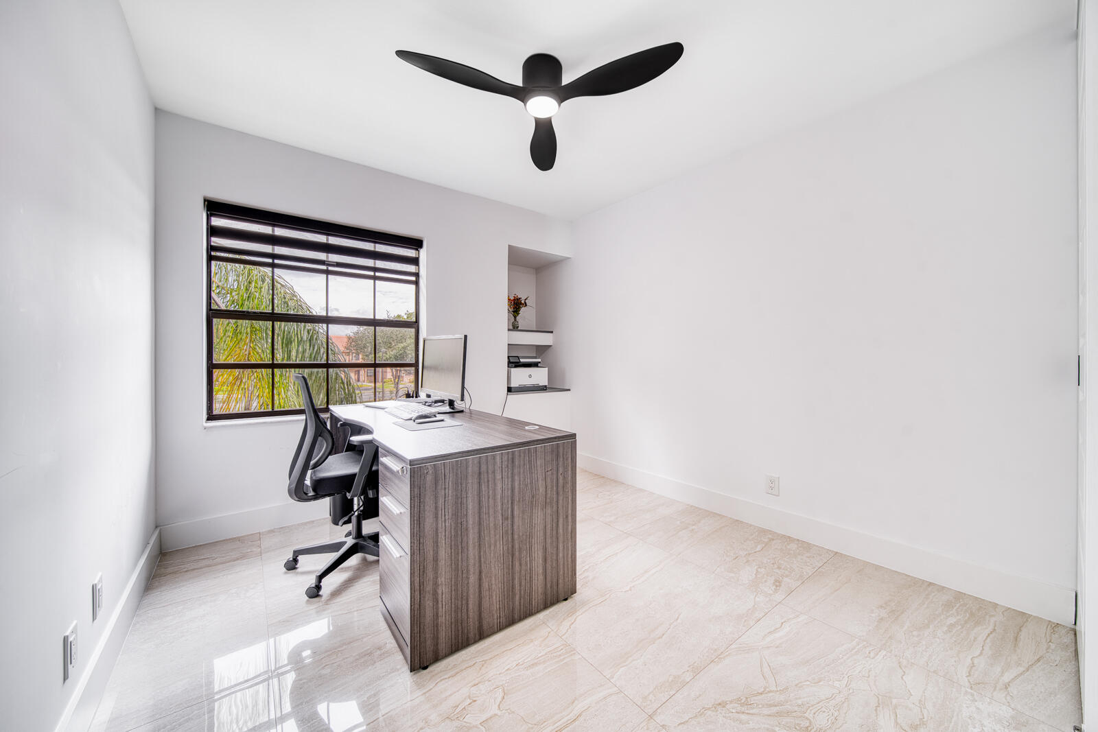 Porcelain tile flooring and zebra blinds.