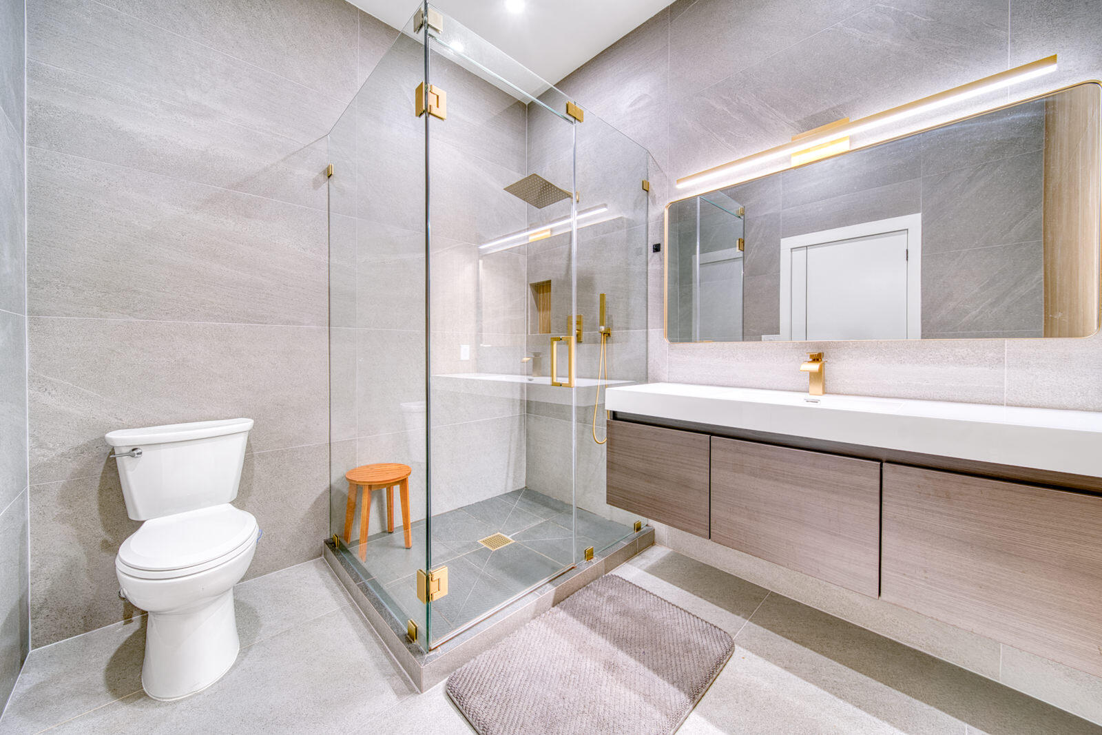 Fully renovated primary bathroom with a floating vanity.