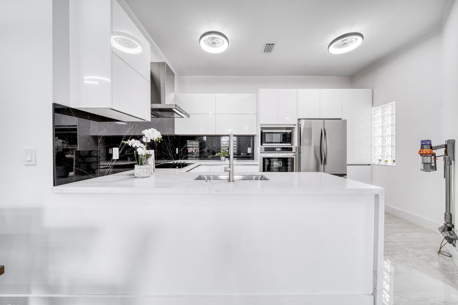 Open kitchen overlooks the dining and living areas.