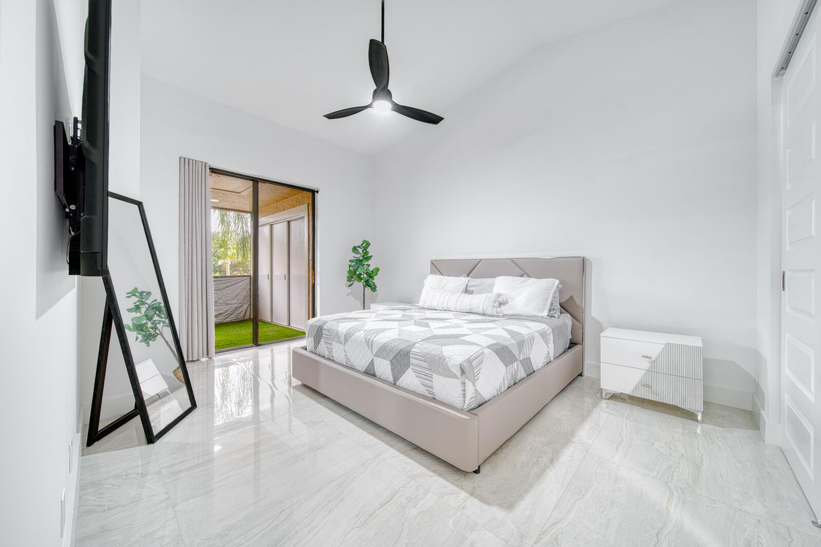 Spacious primary bedroom with abundant natural light.