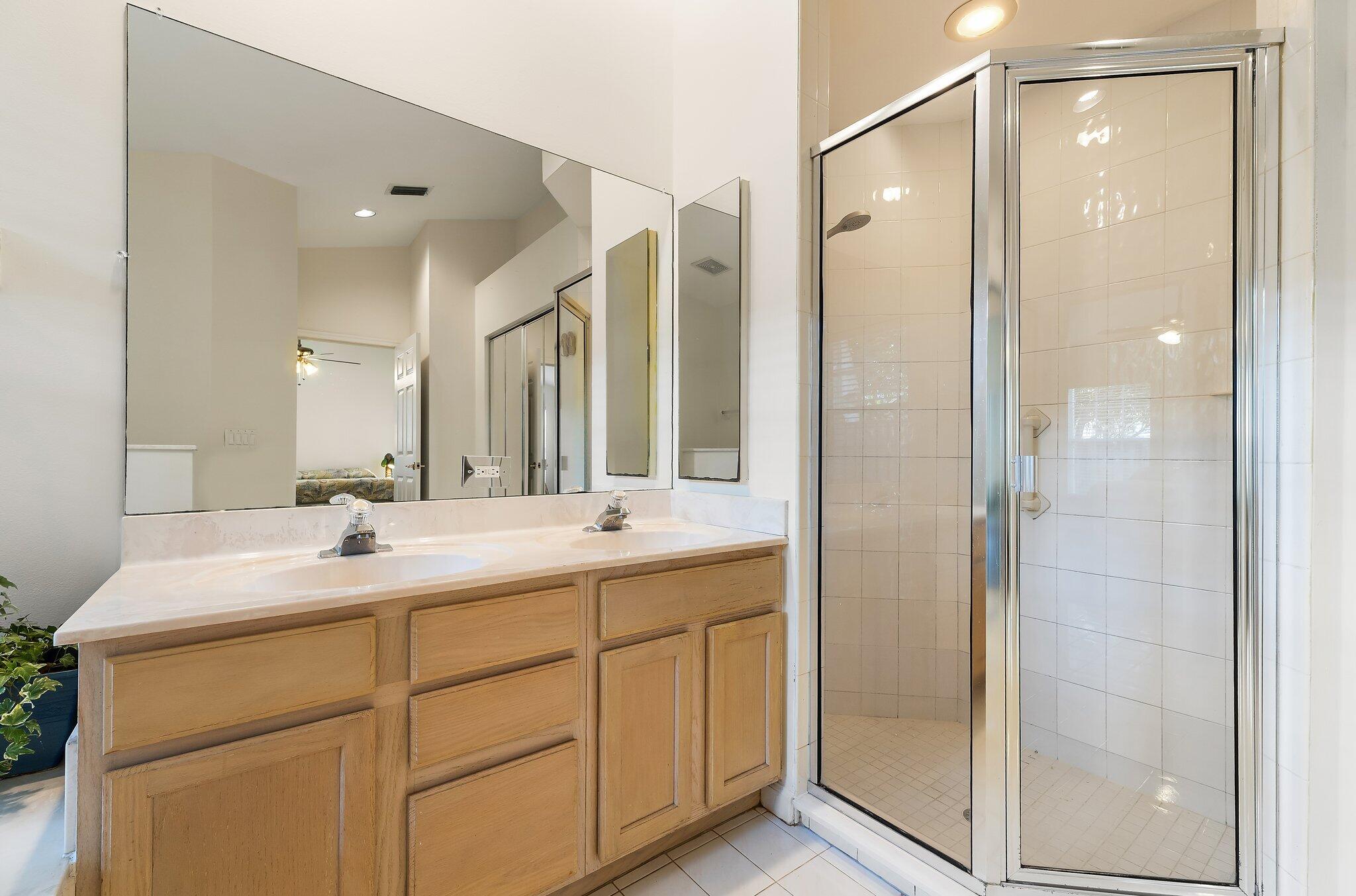 Primary bath with a separate walk-in shower.