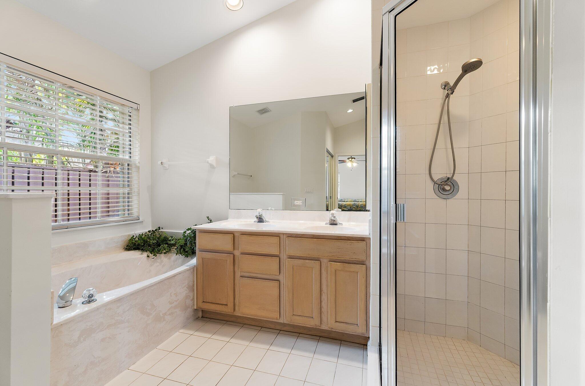 Primary bath with a soaking tub and separate shower.