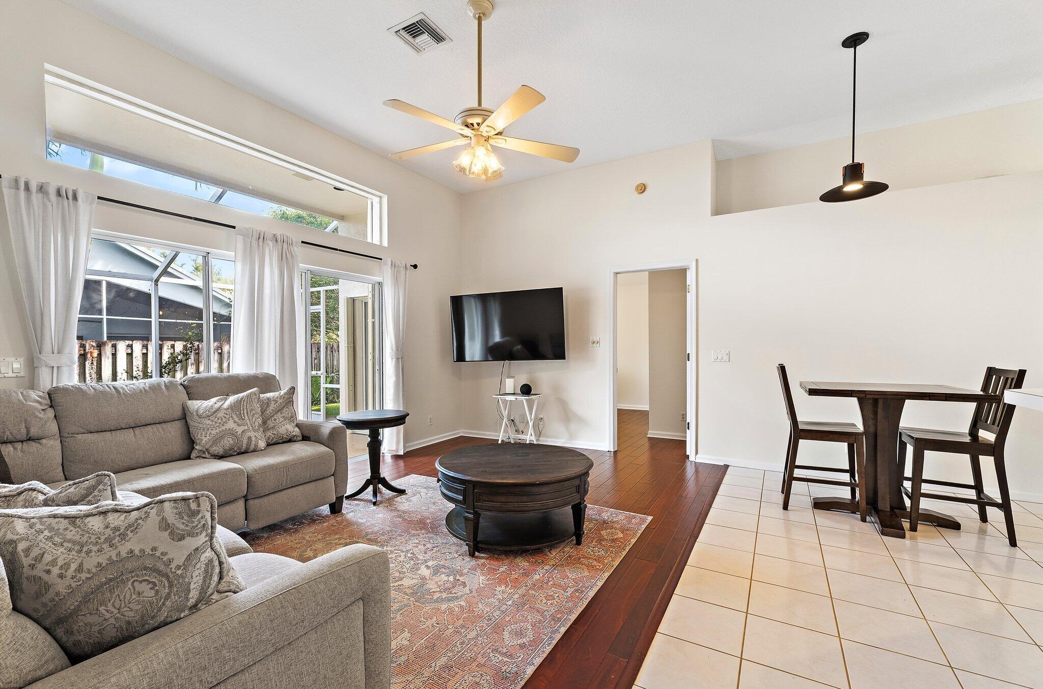 Family room open to the dining area, with glass doors to the patio.