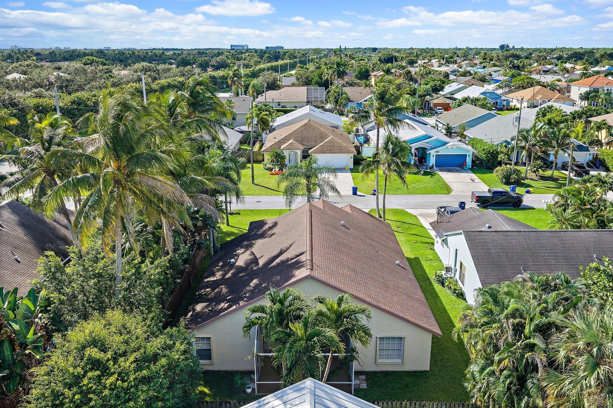 Aerial view of the home and the surrounding Heights of Jupiter neighborhood.
