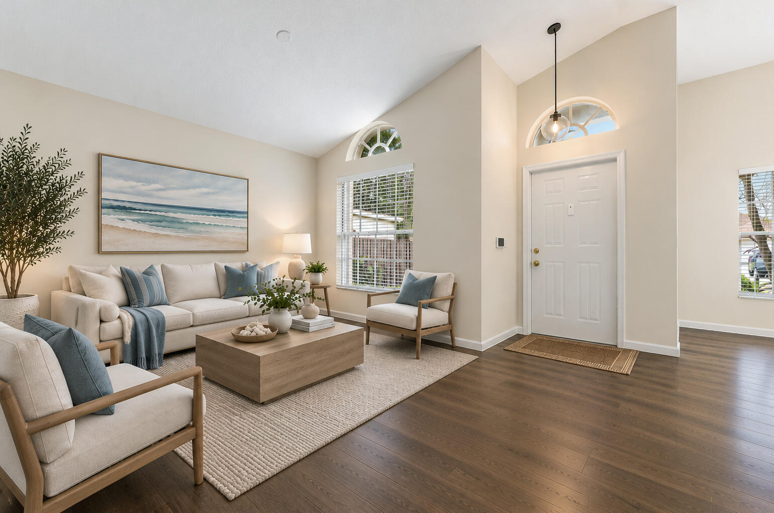 VIRTUALLY STAGED. Living room and entry shown with digital furniture and updated floors to illustrate possible updates.