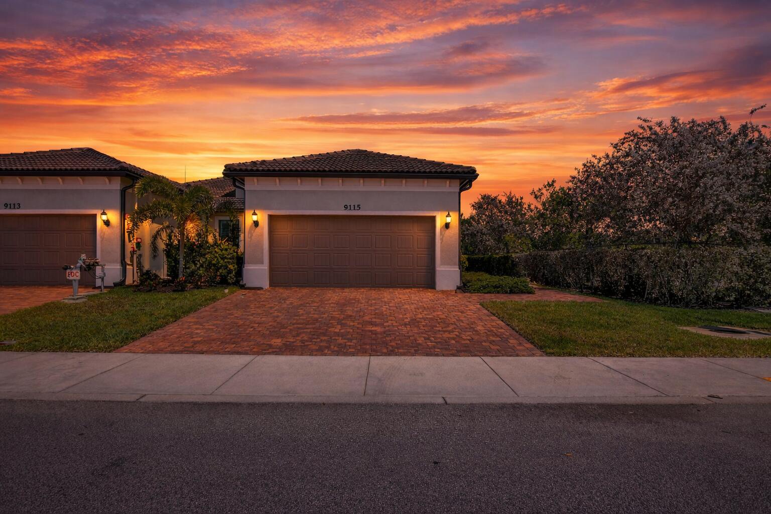 Suburban home at sunset with flowers
