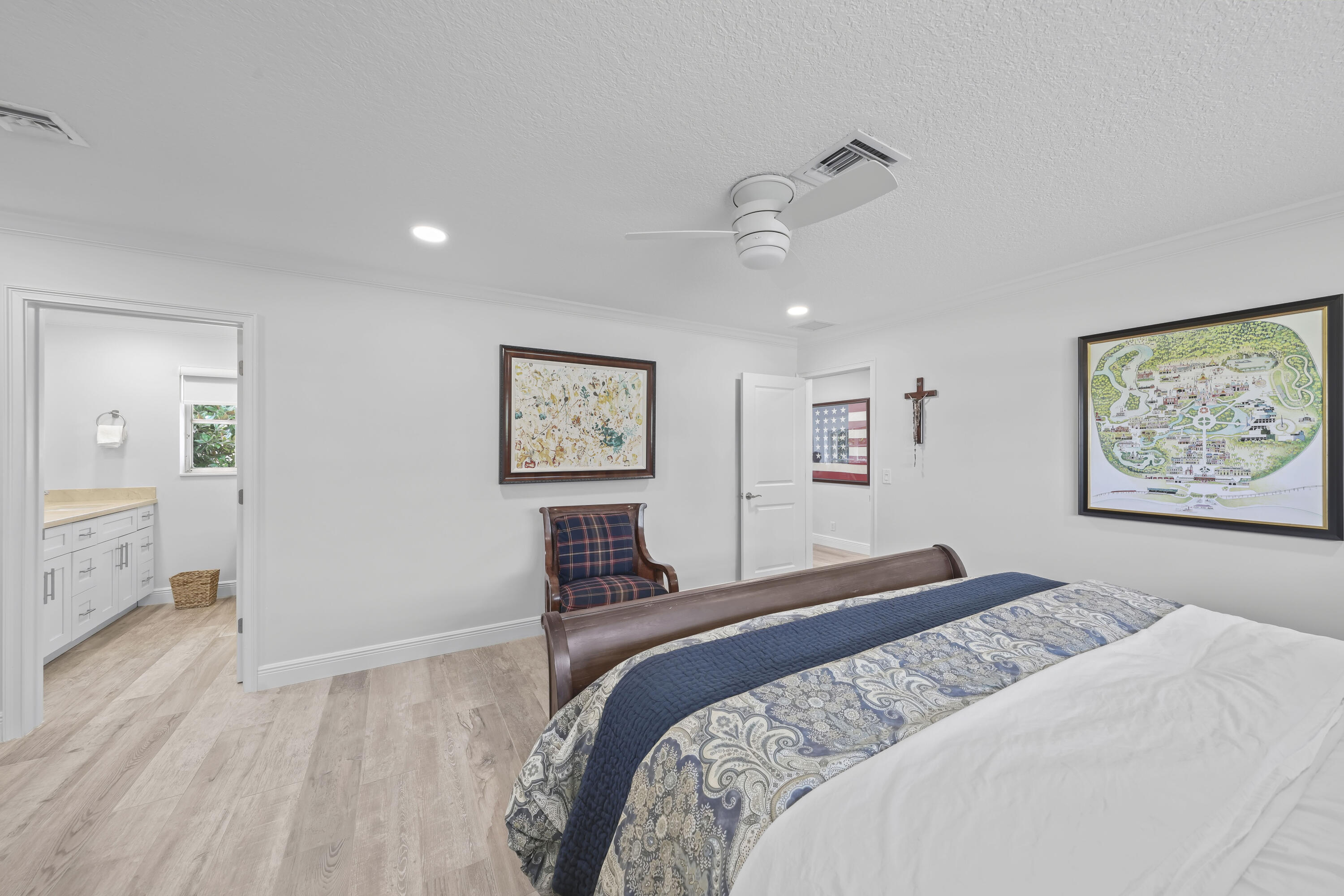 Bedroom featuring wood-finish flooring, recessed lighting, and a white ceiling fan