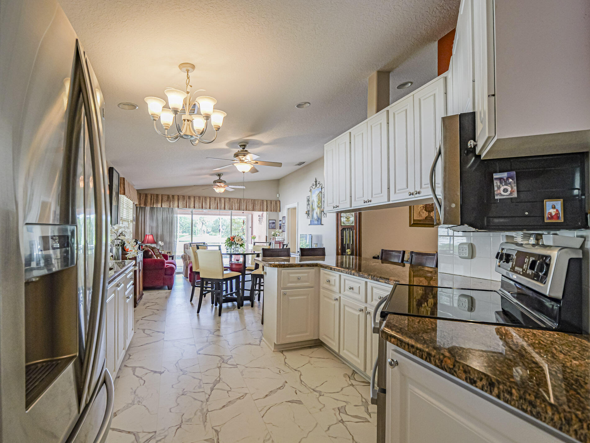 Kitchen opens to Living and Family Rooms