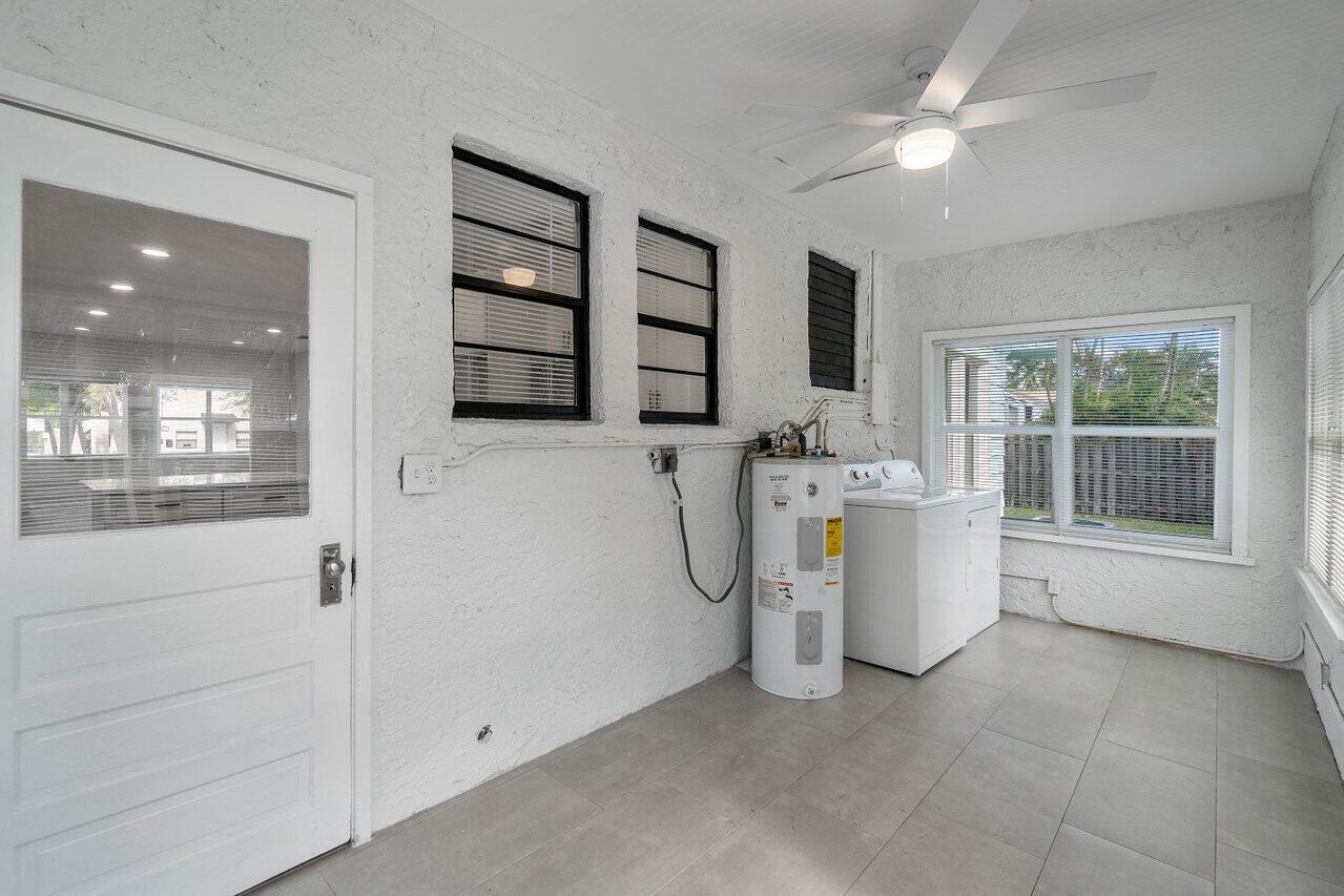 Enclosed back porch, laundry room.
