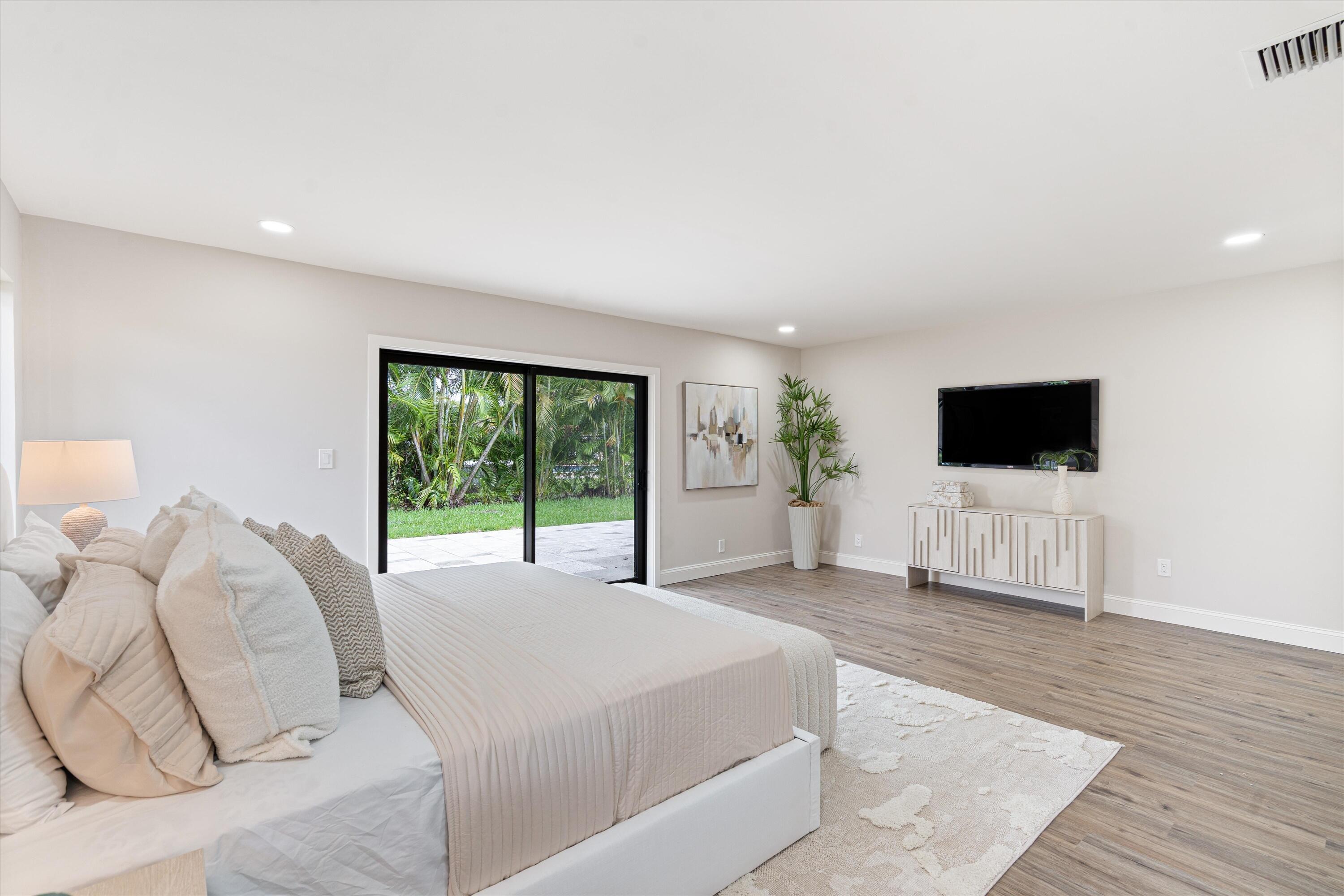 Interior space featuring wood-finish flooring, recessed lighting, and large sliding glass doors