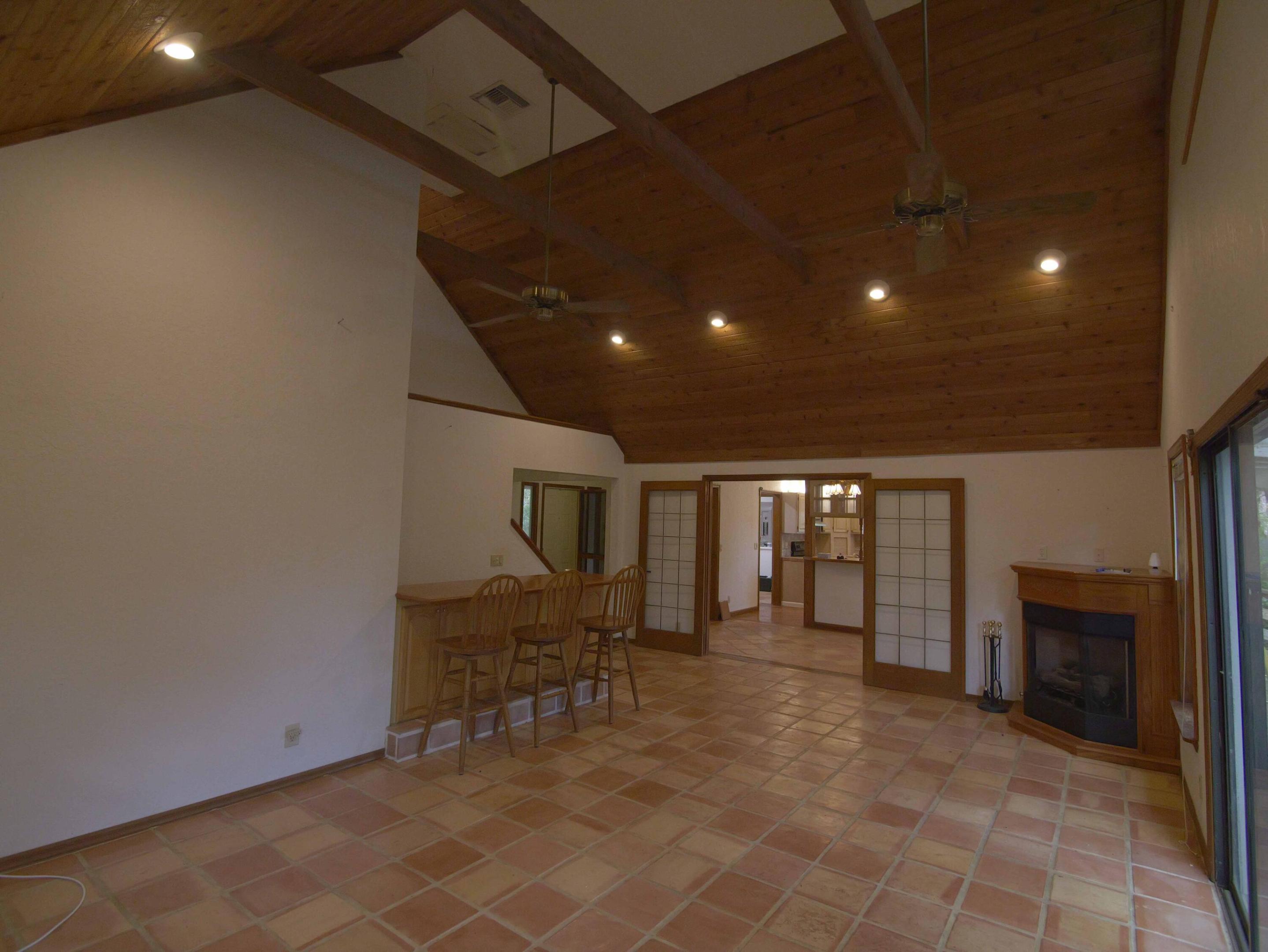 Great Room looking at fireplace & French doors & Kitchen