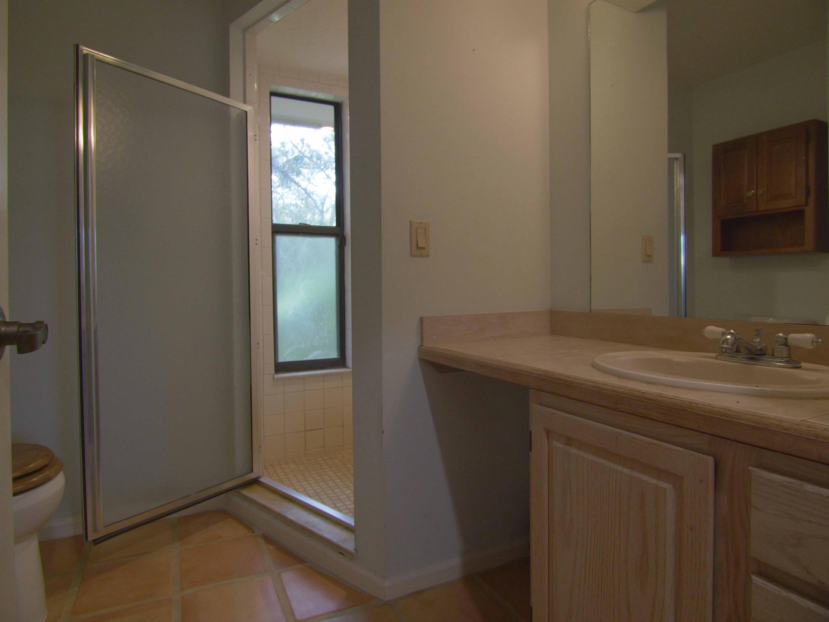 Downstairs FULL Bathroom off Utility room and Kitchen