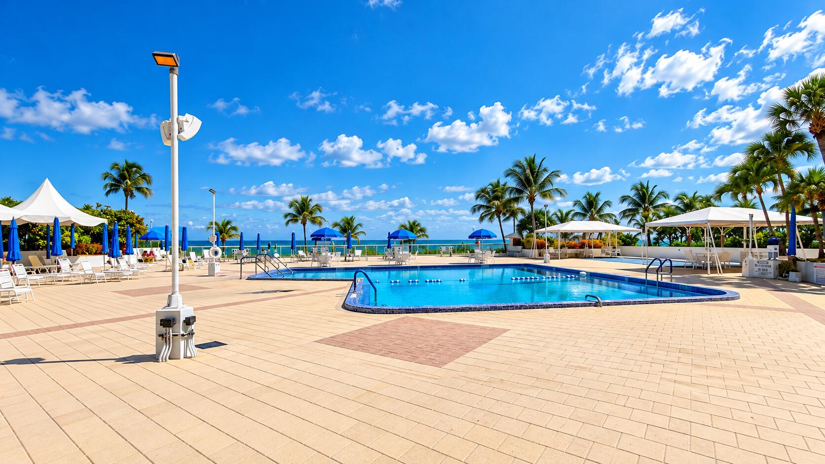 Sunlit Tropical Oceanfront Resort Pool