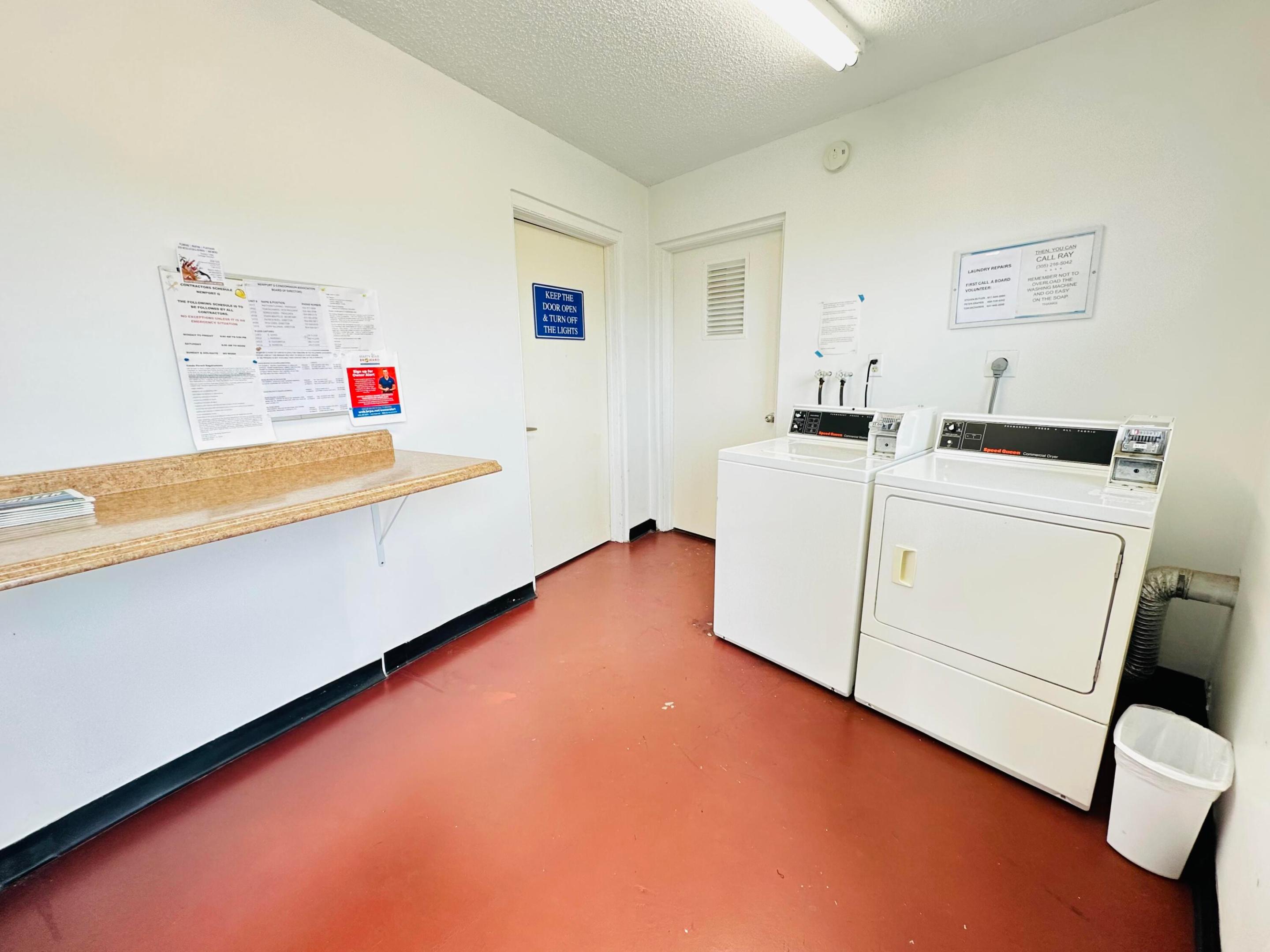Laundry area featuring a wall-mounted laminate folding counter and solid-surface flooring