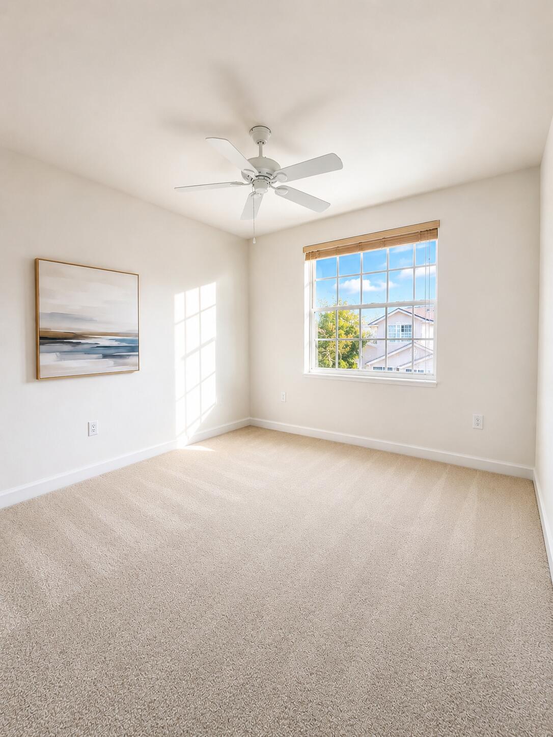 Neutral-toned carpeting, multi-pane window