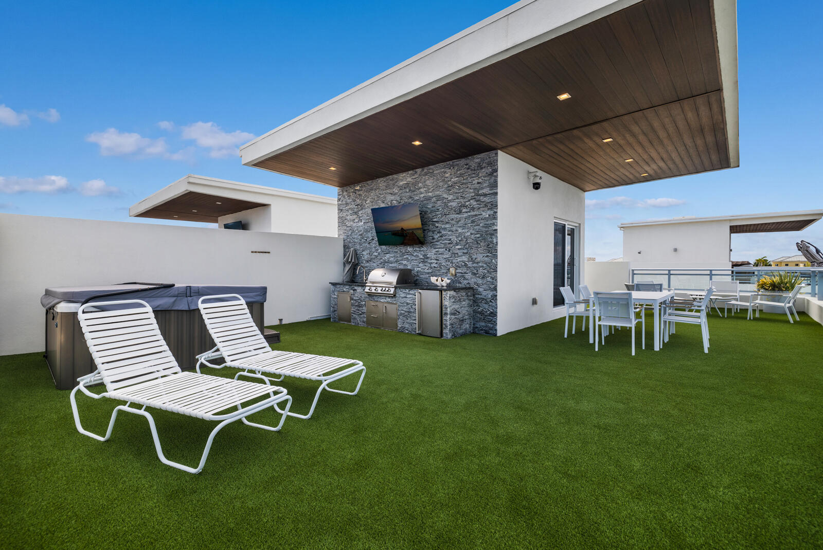 Rooftop terrace featuring summer kitchen and spa.