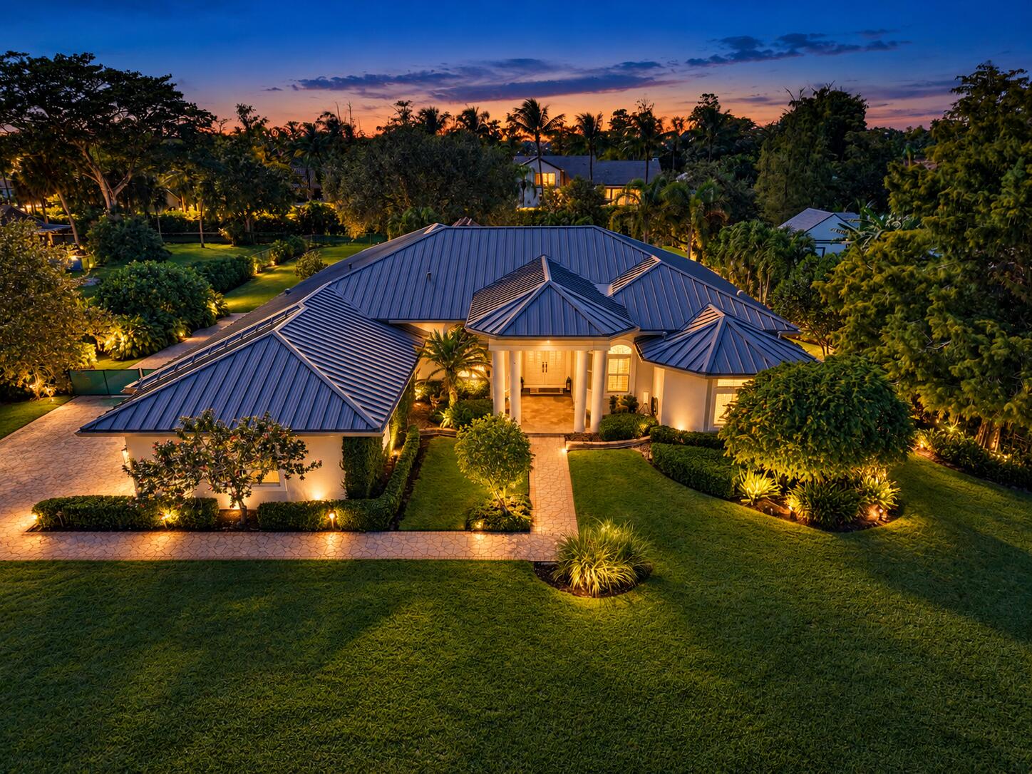 Twilight Estate with Warm Garden Lights