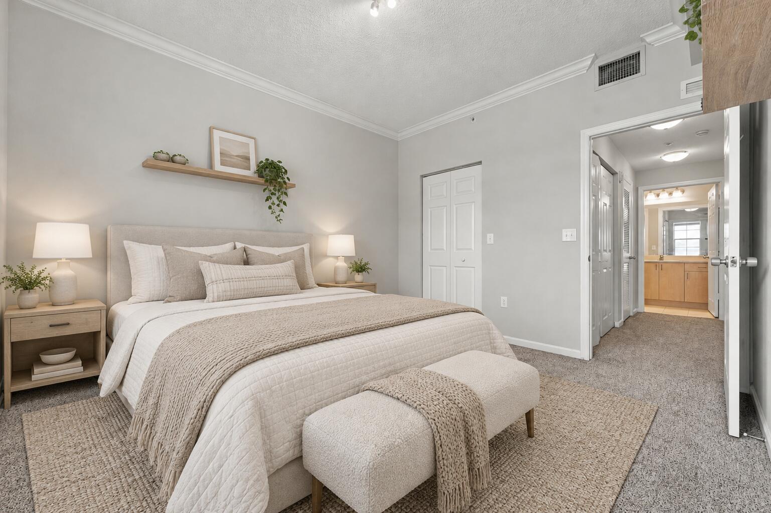 Neutral-toned interior featuring crown molding, wall-mounted floating shelving, and carpeted flooring