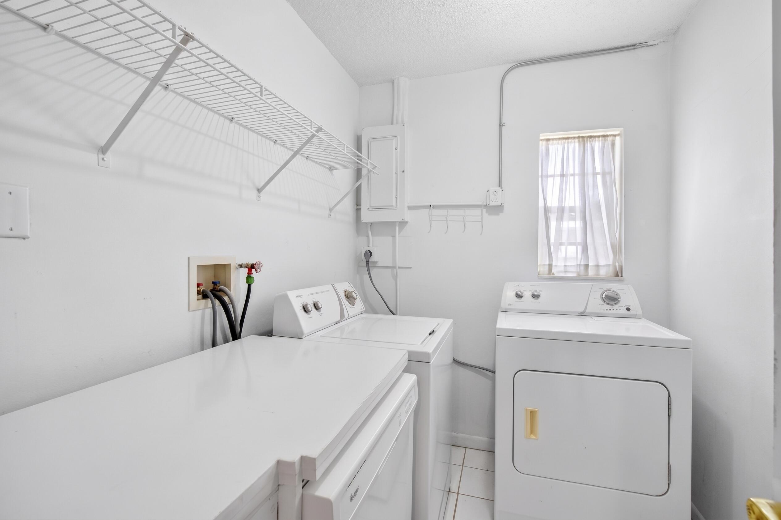 Utility room off kitchen - dishwasher, washer, dryer. AI used to clear personal belongings