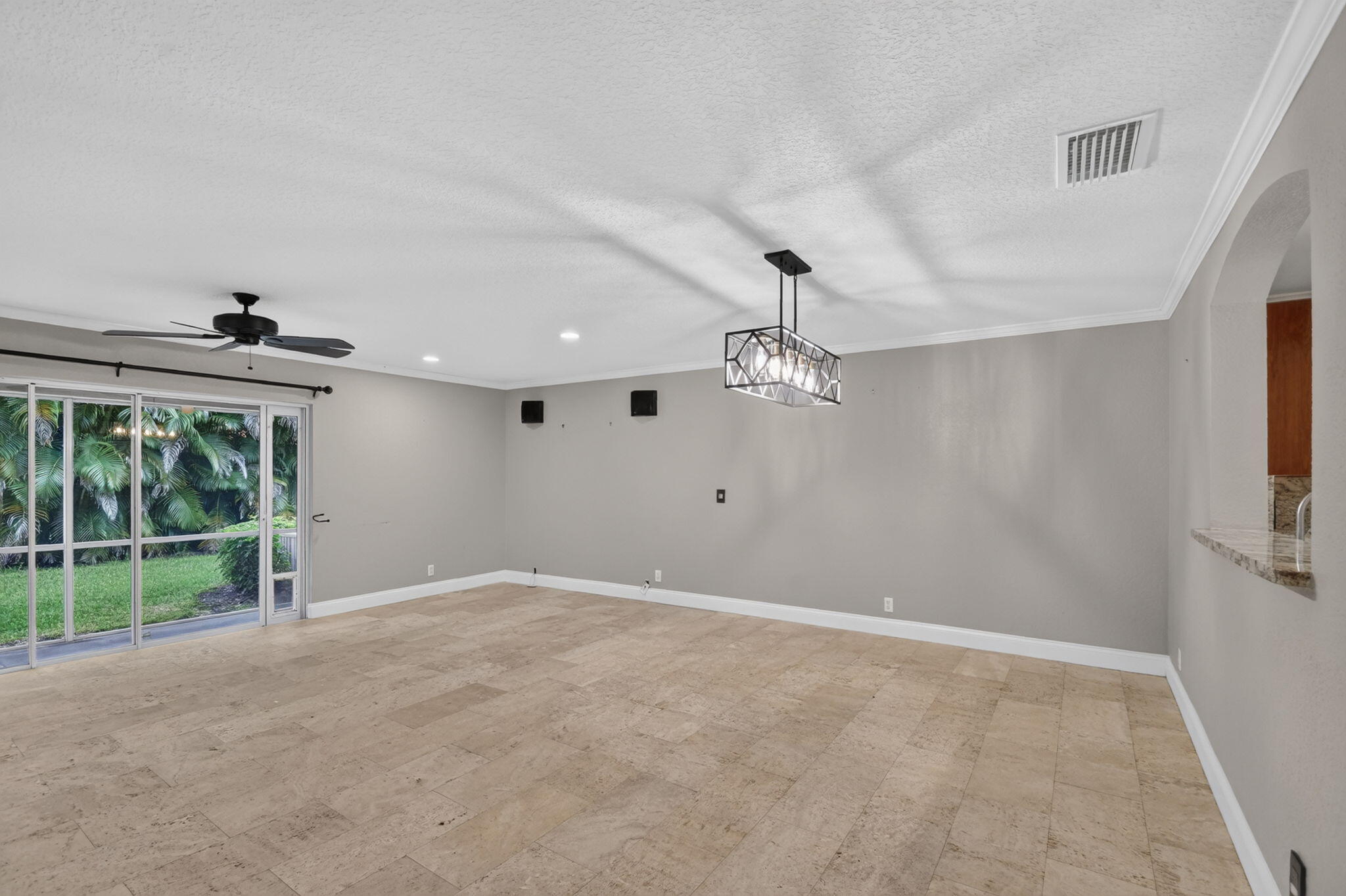 Living room wired for surround sound.